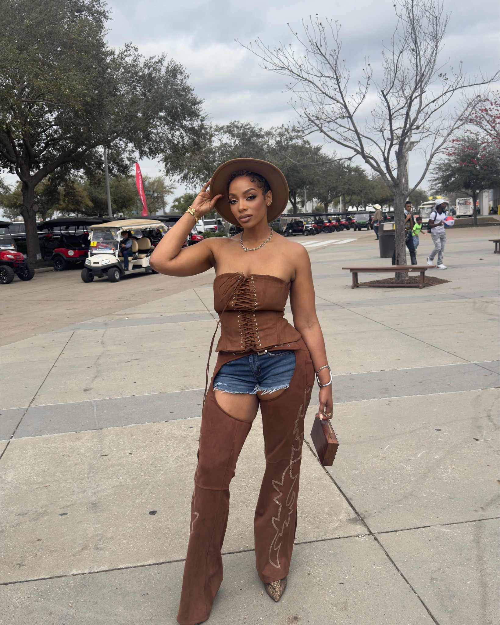 Rodeo ready in the Hoedown Corset in Brown, Smoke Hour Suede Chaps in Brown, and Flex-Fit High Waisted Super Stretchy Denim Shorts—paired with the statement Azalea Wang Couture Crazy Snake Boots and a classic Western Cowboy Wide Brim Fedora Hat. The perfect mix of cowgirl & couture! Shop the full look on my @shop.ltk! #RodeoStyle #WesternGlam #LTKFashion