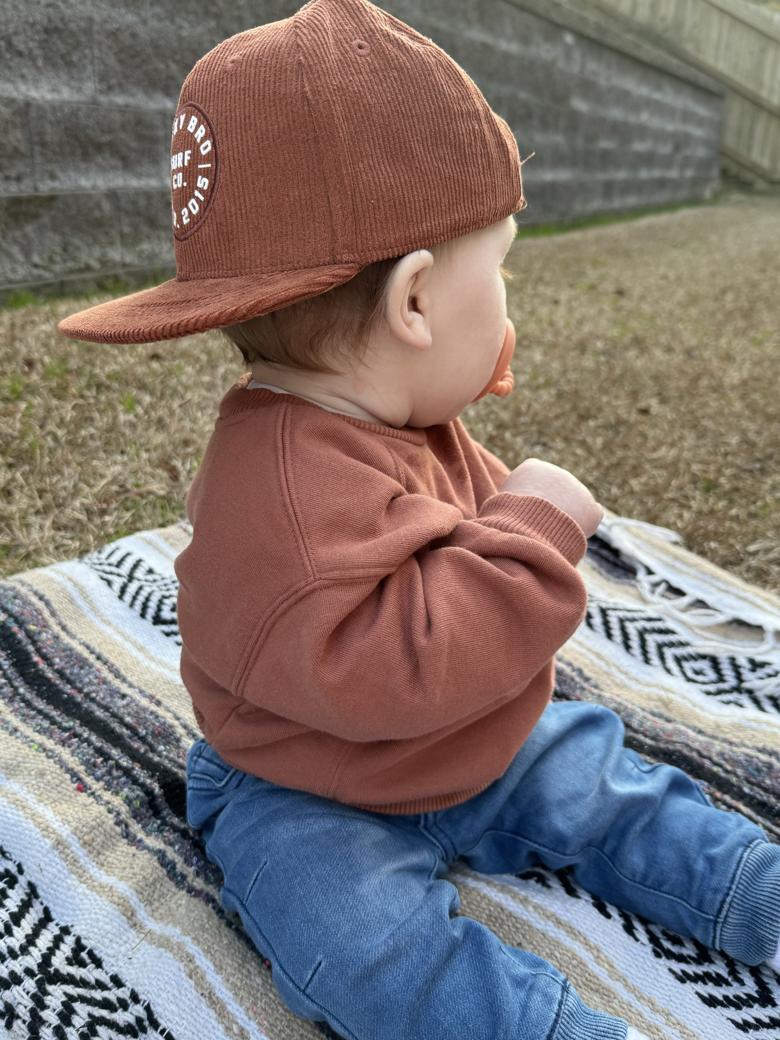 A baby boy in a sweatshirt and jeans! Perfect for the park. This sweatshirt is sold out in this color but the others are just as cute!! Hat is binky bro - you can find it on their site or I linked another retailer!

#LTKbaby #LTKfamily #LTKkids