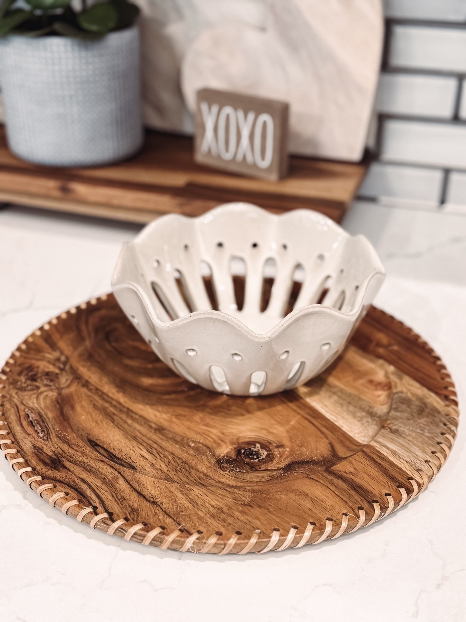 Swooning is an understatement! This combo is chef’s kiss for everyday kitchen styling and entertaining.

I am absolutely obsessed with this gorgeous ceramic berry bowl paired with my new wood charger plates. The neutral, scalloped design is timeless and adds the prettiest texture to any countertop or table setting. Perfect for rinsing berries, serving fruit, or styling on open shelves. The wood chargers bring in that warm, organic touch that instantly elevates everyday meals and makes hosting feel extra special. Bonus: the berry bowl also comes in a larger handled version in the dreamiest light teal blue, plus multi-colored individual serving sizes that are perfect for brunches, desserts, or summer entertaining. 

ceramic berry bowl • berry colander • fruit bowl with holes • kitchen counter decor • wood charger plates • wooden chargers • farmhouse kitchen decor • neutral kitchen accessories • tabletop styling • entertaining serveware • modern farmhouse kitchen • brunch serving dishes

#kitchenfinds #homedecor #tabletopdecor #entertainingathome #modernfarmhouse #neutralhome #kitcheninspo #hostingideas #berrybowl #chargerplates #ltkhome #homefinds #tablescaping #cozyhome

#LTKHome #LTKfoodie