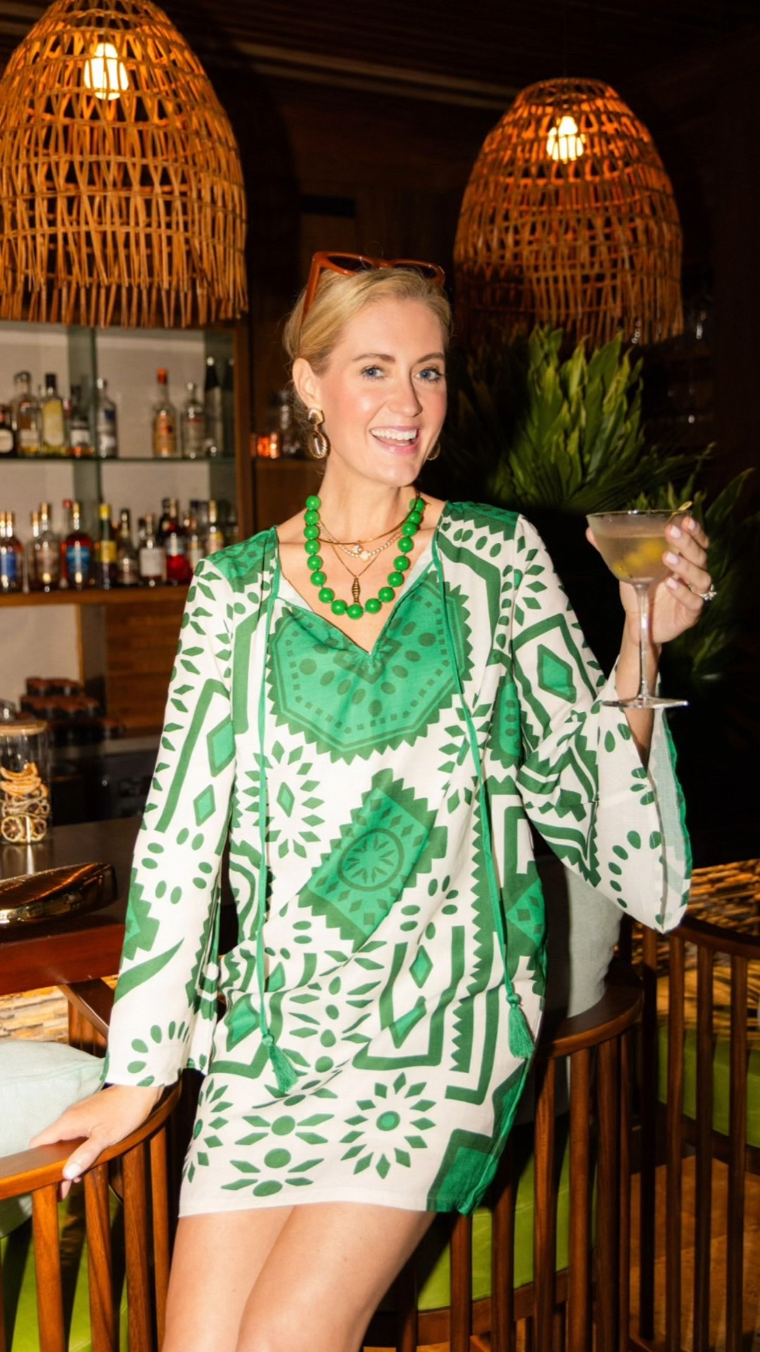 This green printed mini dress brings bold color and an easy resort vibe, perfect for dinner, drinks, or a warm night out when you want to feel fun but still put together.

#LTKTravel #LTKootd