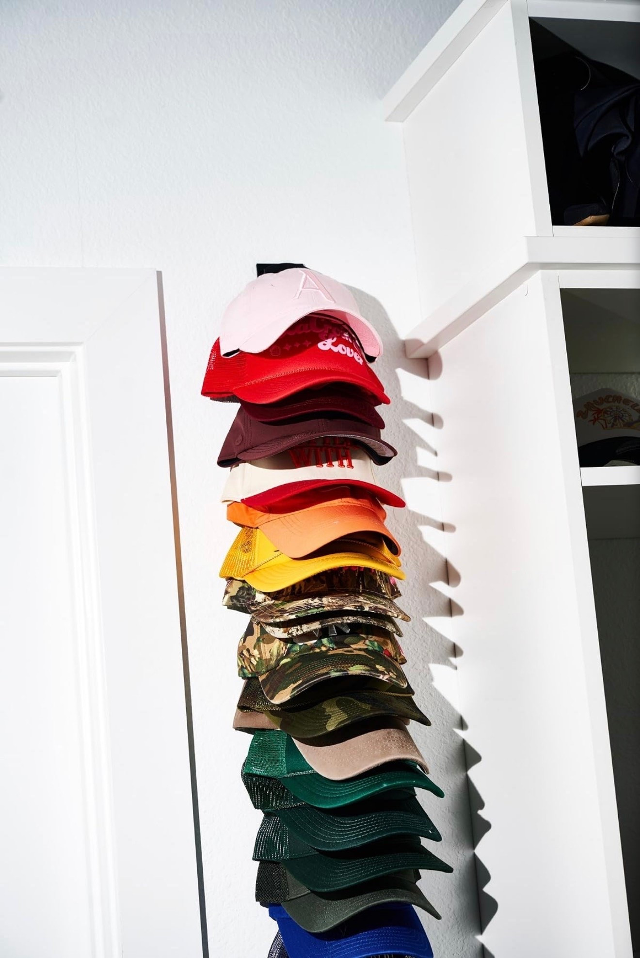 Hat wall organizer that helps keep all my hats visible and organized!

#LTKootd