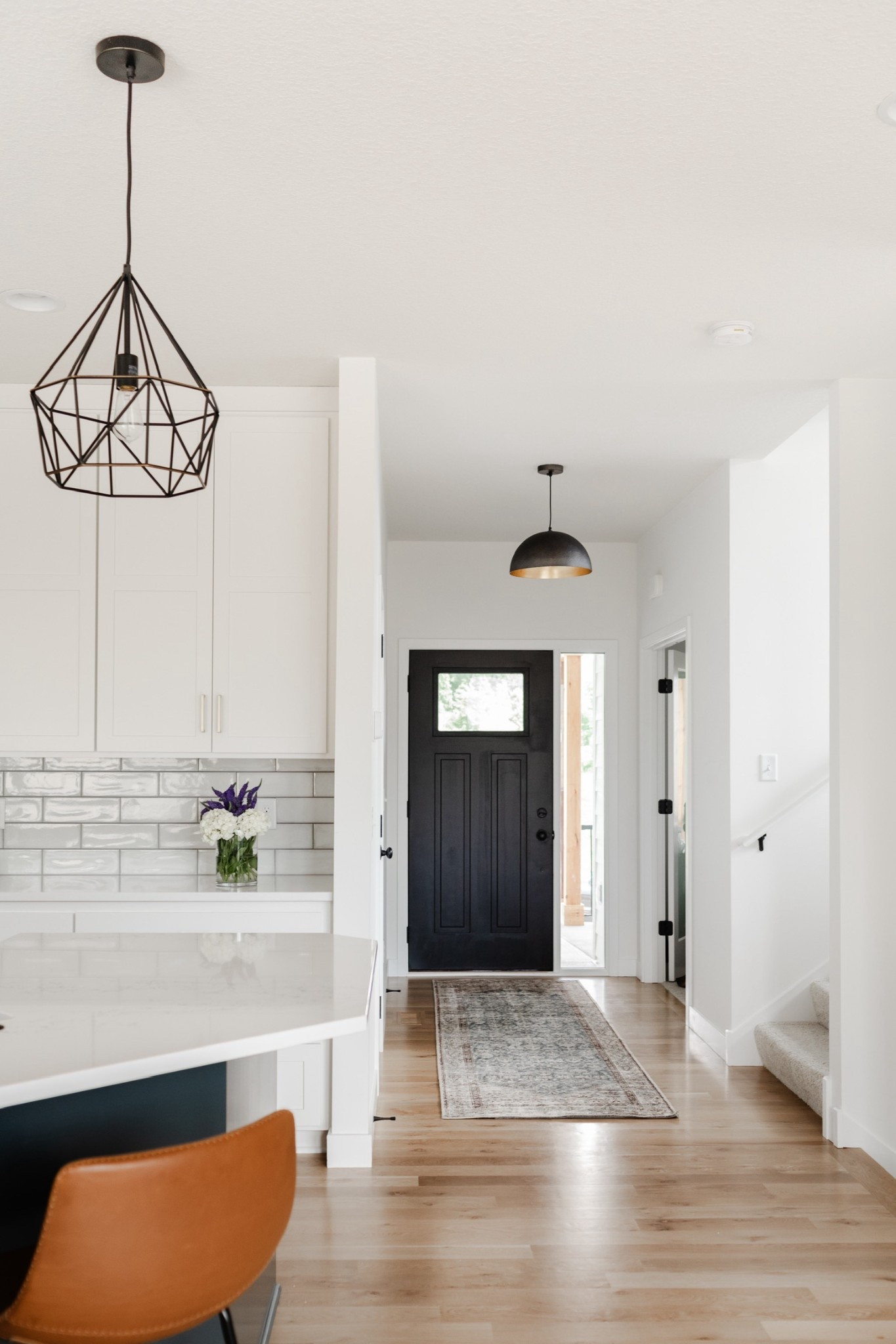 Simple yet stylish entryway inspo. In our #IGHnewbuild the black front door creates a bold contrast from the white walls. We then incorporated a runner rug and a black industrial dome pendant light, to make a statement.💡

#LTKHome #LTKFindsUnder100 #LTKSaleAlert