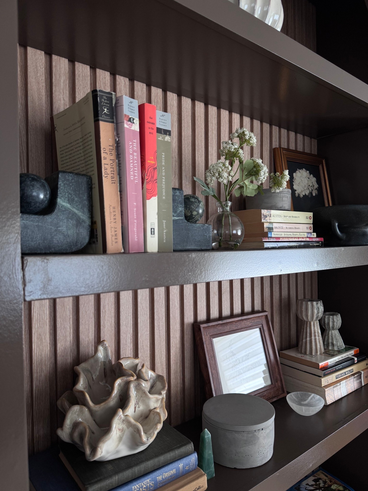 @Target Shelf styling that actually looks intentional without spending a fortune. Everything you see here is from Amazon and Target, and it proves you do not need a designer budget to create a space that feels curated and collected.
The key to a shelf like this is layering textures and mixing organic shapes with structured ones. Think ceramic vessels, natural stone bookends, a simple glass bud vase with dried or fresh florings, vintage-style frames, and a stack of classic hardcovers. The fluted wall panel backdrop adds depth without any renovation required.
Whether you are starting from scratch or just refreshing a bookcase, these pieces do the heavy lifting. Shop everything linked below.

shelf styling ideas, bookshelf decor, Amazon home decor, Target home finds, budget home decor, affordable interior design, shelf inspo, living room bookshelf, home styling tips, curated shelf, organic modern decor, neutral home aesthetic, bookshelf organization, LTK home, home decor under $50

#ShelfStyling #BookshelfDecor #AmazonHome #TargetHome #BudgetHomeDecor #HomeDecorInspo #OrganicModern #NeutralHome #LTKUnder50 #AffordableDecor #HomeStyleTips #CuratedShelf #InteriorDesignIdeas #ShelfDecor 
#HomeInspo #BookshelfStyling #CozyHome #HomeAesthetic #TargetFinds​​​​​​​​​​​​​​​​


#LTKHome