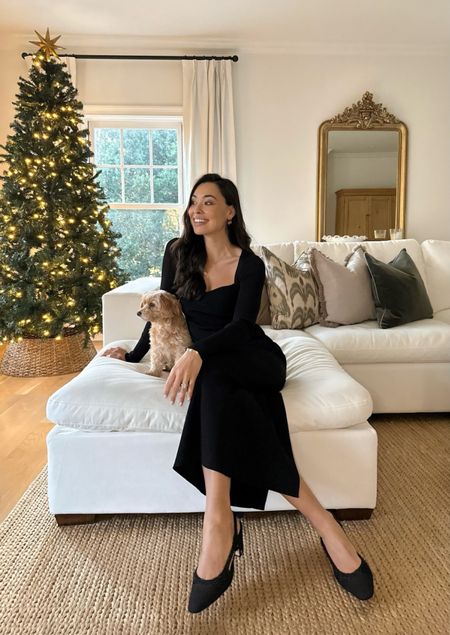 Kat Jamieson wears a knit dress and Chanel slignback pumps. Couch is Costco. Pillows, living room, decor, interior design, holiday outfit, Christmas Eve.  

#LTKSeasonal #LTKhome #LTKHoliday