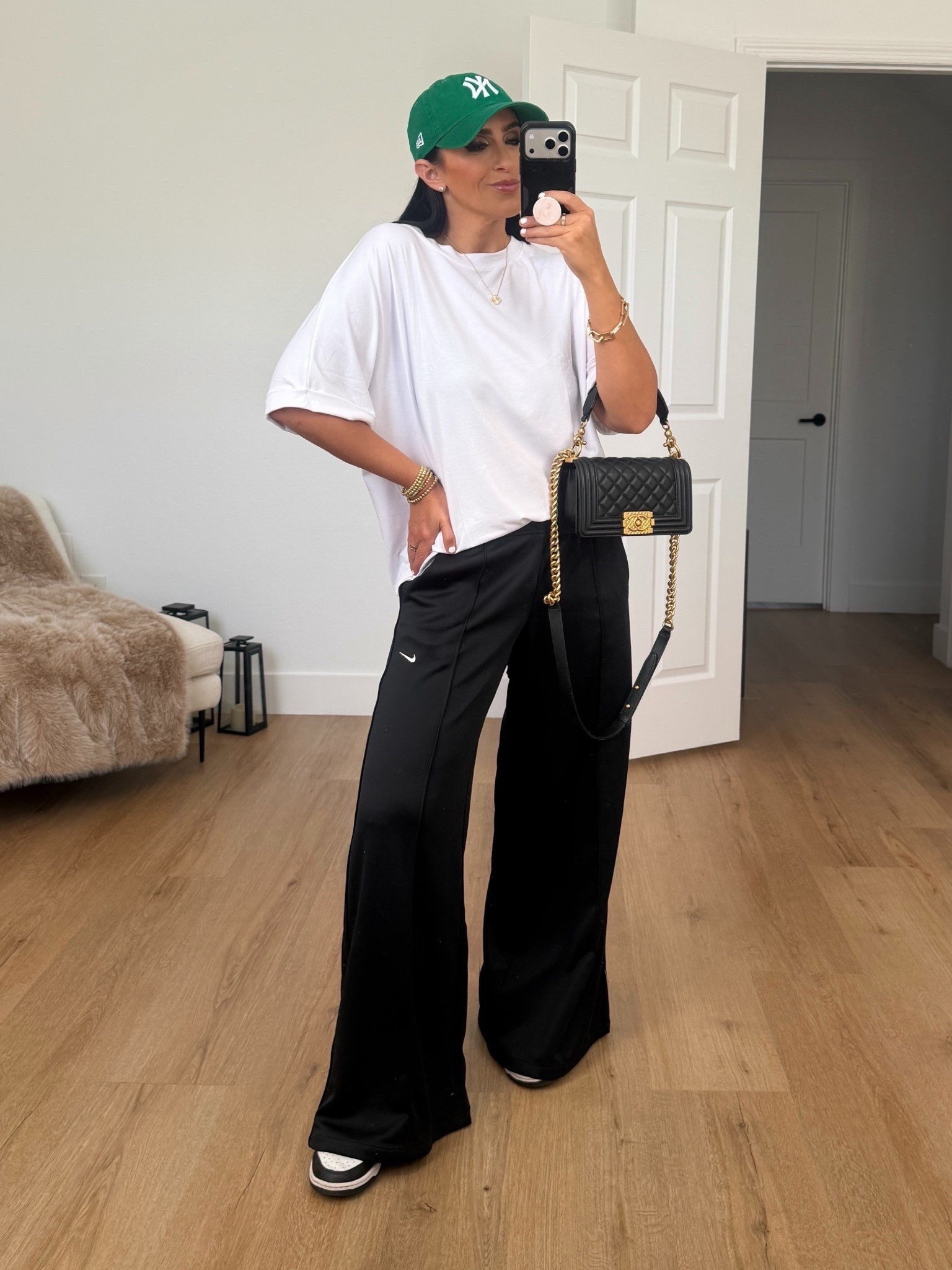 Nike Sportswear Women's Mid-Rise Wide-Leg Track Pants. White tshirt wearing size medium.