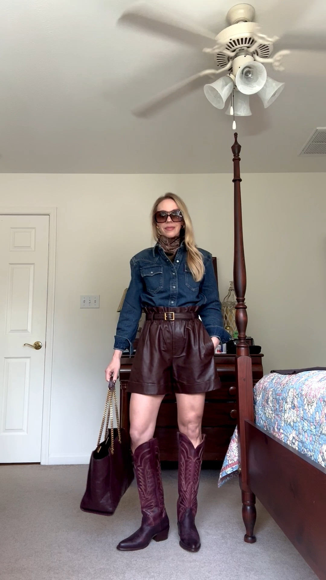 Western chic fall outfit with paisley silk scarf, @levi western denim shirt, leather shorts and @Tecovas burgundy cowboy boots