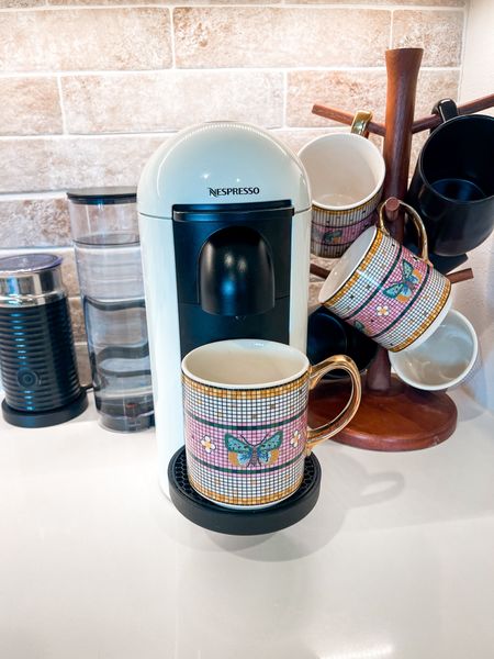 Nespresso. 
Pretty kitchen appliances. 
White coffee maker. 
Anthropologie 
Pretty mugs. 
Butterfly home decor 
Milk frother  

#LTKStyleTip #LTKHome #LTKGiftGuide