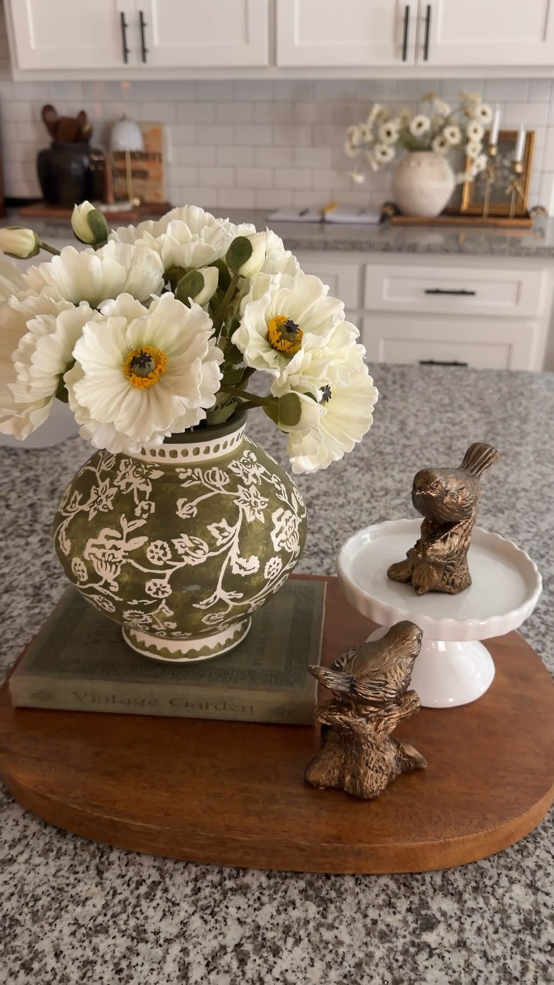 Breadboards aren’t just for bread. 🥯 Here I used one of mine as a base for my arrangement. 


Featuring real touch poppies in the prettiest vase, paired with a sweet set of little birds, a small riser, and a book for added height.