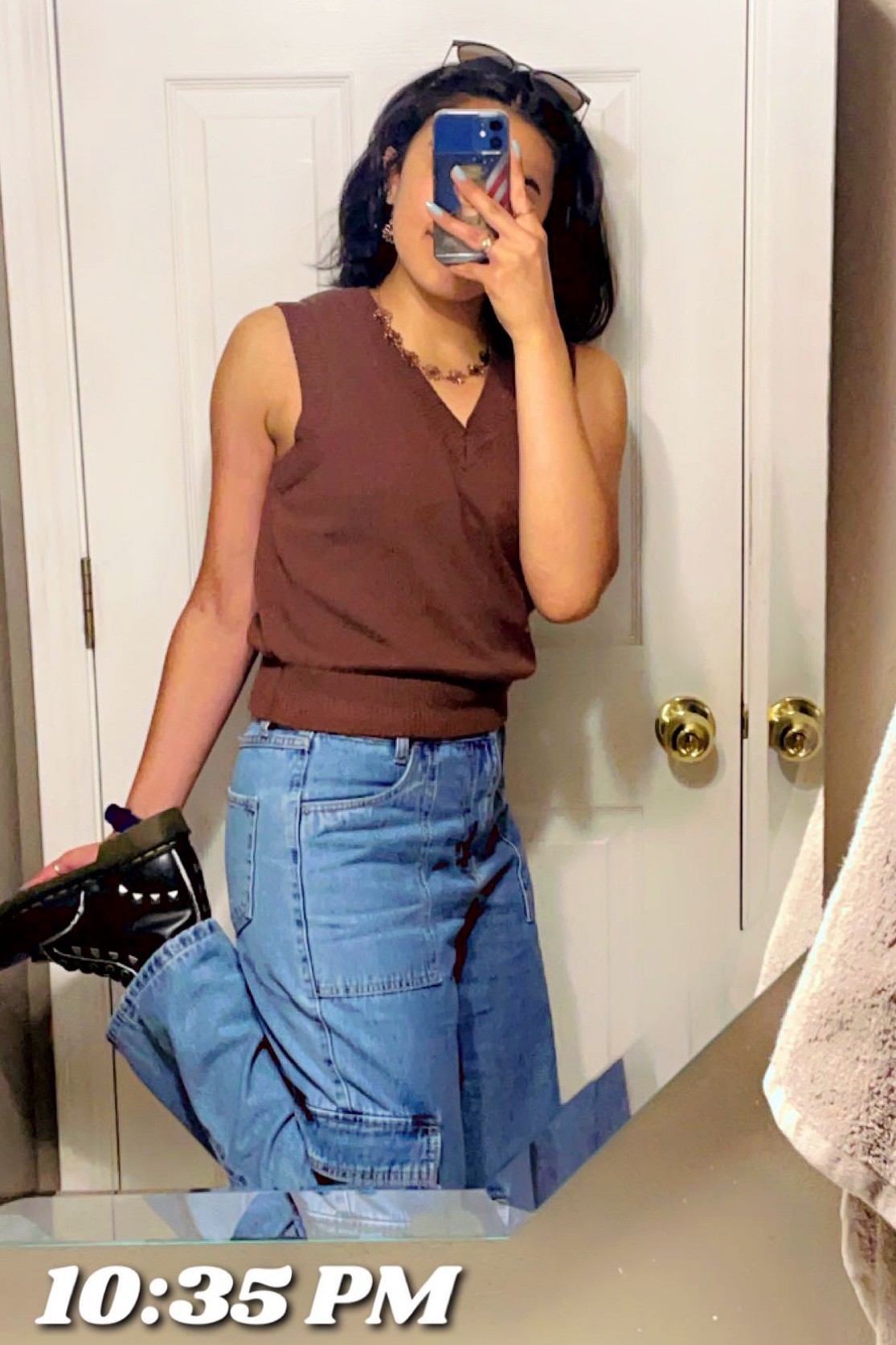 V neck sleeveless chocolate brown knit sweater vest women’s high rise cargo jeans denim big pockets rose gold flower necklace and earring set doc martens fall outfit sweater weather pumpkin patch picking outfit halloween cozy casual dinner outfit black boots studded 

#LTKHalloween #LTKSeasonal #LTKfit