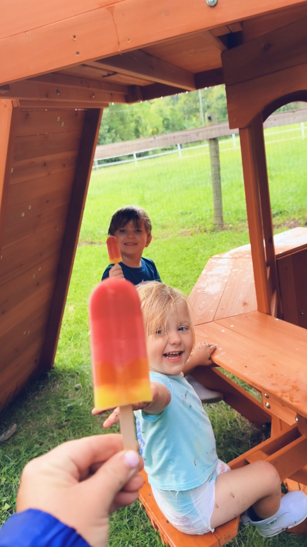 And popsicles out under the playhouse… these truly are the DAYS !!!! 🍧🛝🌳🌧️