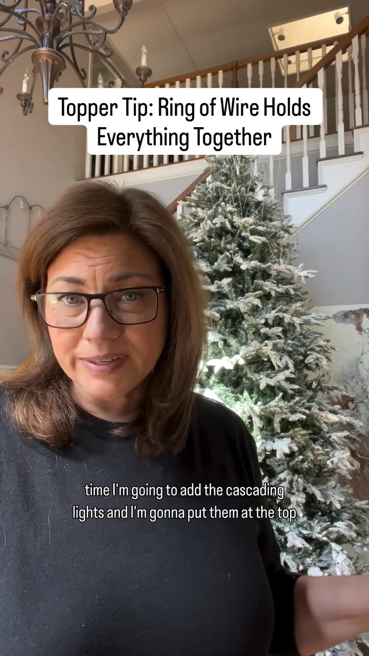 This simple wire trick keeps everything at the top of the tree in place including the cascading lights.  Here’s a simple trick that makes a huge difference when decorating your tree topper!
I always keep a ring of wire loosely around the top of my tree — it helps hold my topper picks securely in place. Now, I’m also using it to hold my cascading lights! 💫

Just drop your picks (or cascading lights) down through the ring, and the tension tightens around them to keep everything steady and beautiful. 🙌

Comment “Cascade” for links to the cascading lights I’m using!

#ChristmasTree #Christmas #Decorating #ChristmasDecorating #CascadingLights #HolidayDecor #ChristmasLights #Lights #WarmWhiteLights #TwinkleLights #Decor #ChristmasDecor