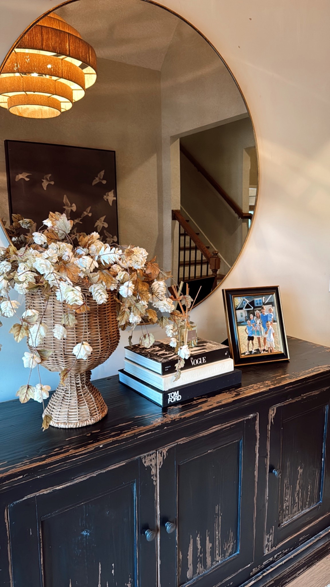 Faux silk hops are such a favorite faux flower arrangement of mine. Have this setup in our foyer. Rattan urn I found at Marshall’s! 