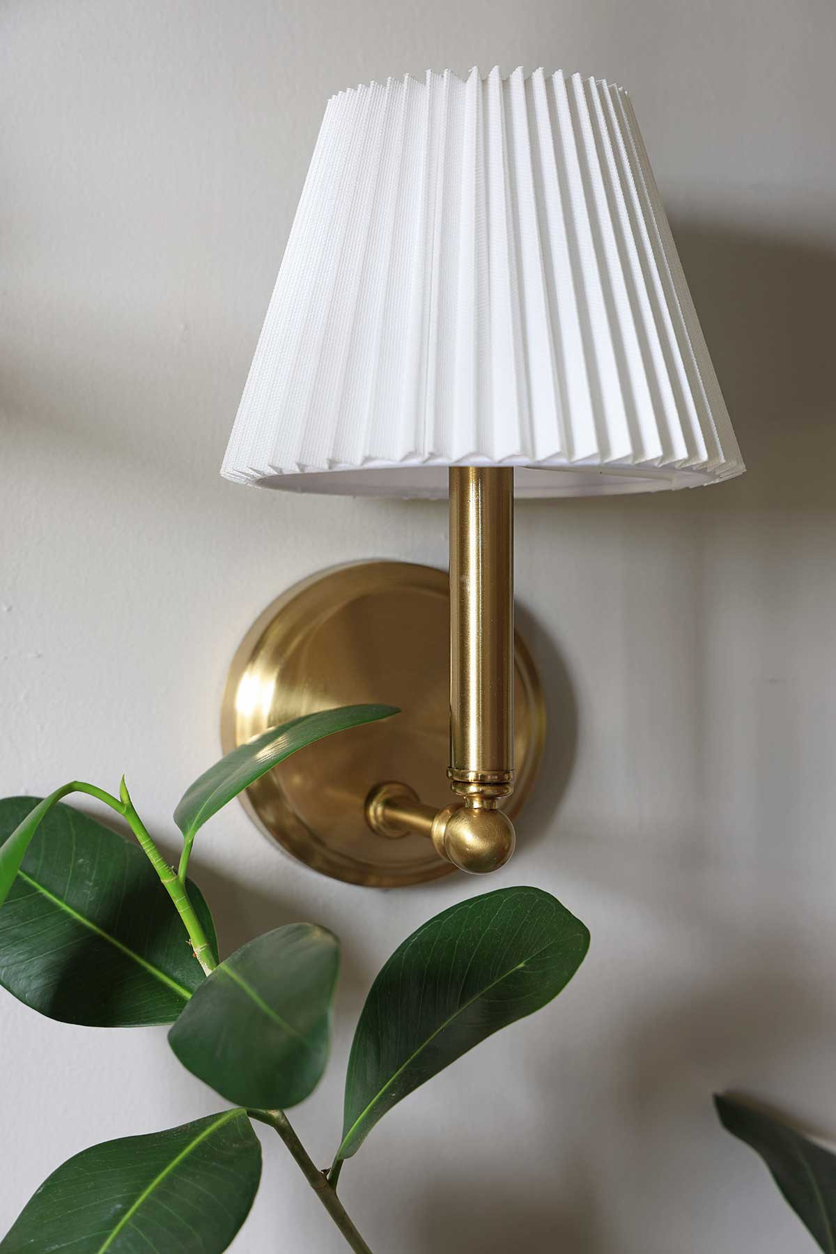 Incredibly charming brass sconce with pleated shade | The perfect little light fixture to fill an empty corner and add a little ambiance! | Shop this exact sconce, or some other beautiful options! 

 #LTKHome
