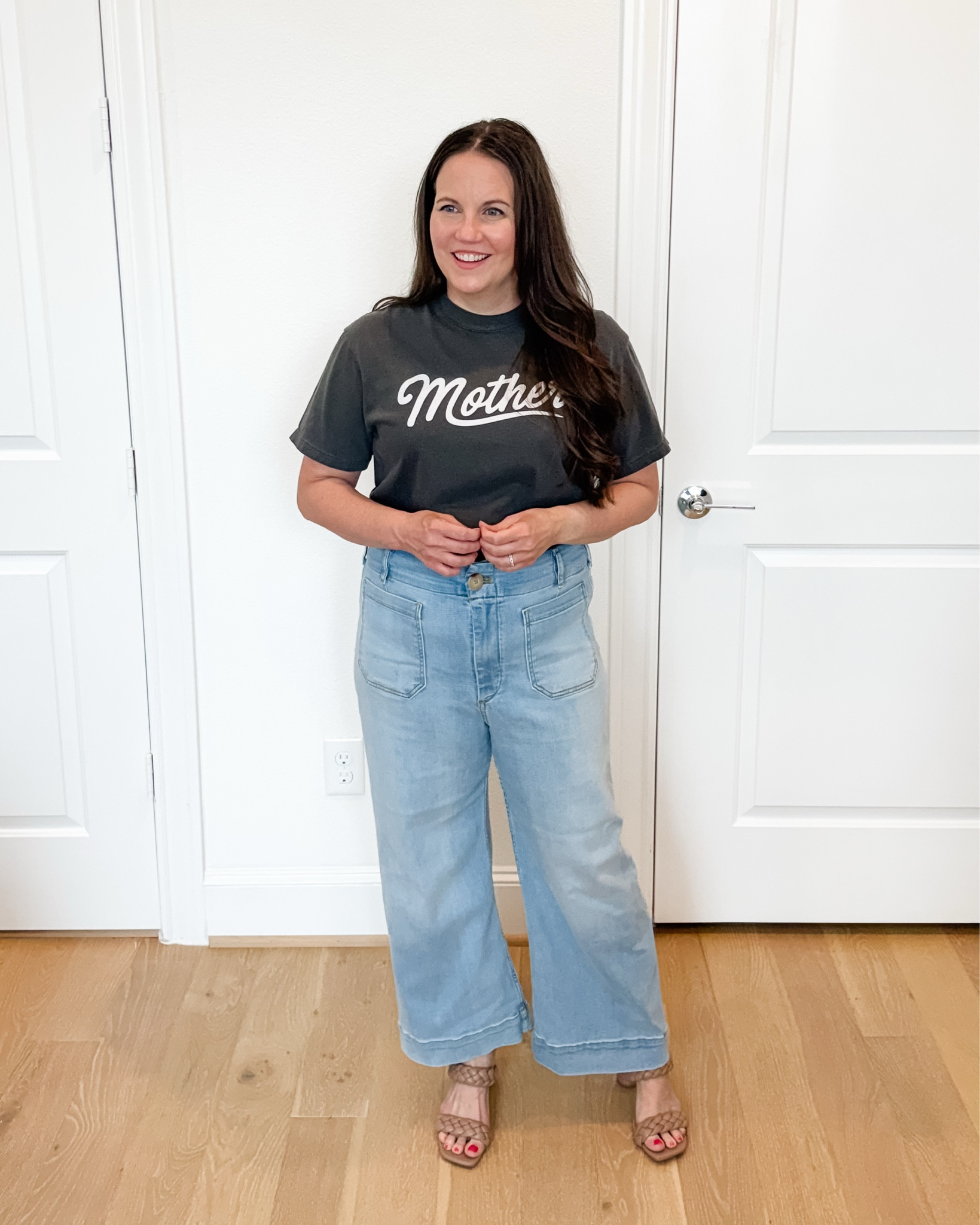 This casual chic and easy mom outfit pairs a dark gray mother graphic tee with light wash flared jeans and braided sandals for a look that feels comfortable, elevated, and effortless. These jeans with stretch are incredibly flattering and perfect for everyday wear, while the graphic tee is one of my favorite mom shirts for adding personality to a simple outfit. Whether you’re heading out for lunch, running errands, traveling, or packing a vacation outfit, this classic combination is a staple for creating stylish summer outfits you’ll wear on repeat.

#LTKSeasonal #LTKMidsize #LTKOver40