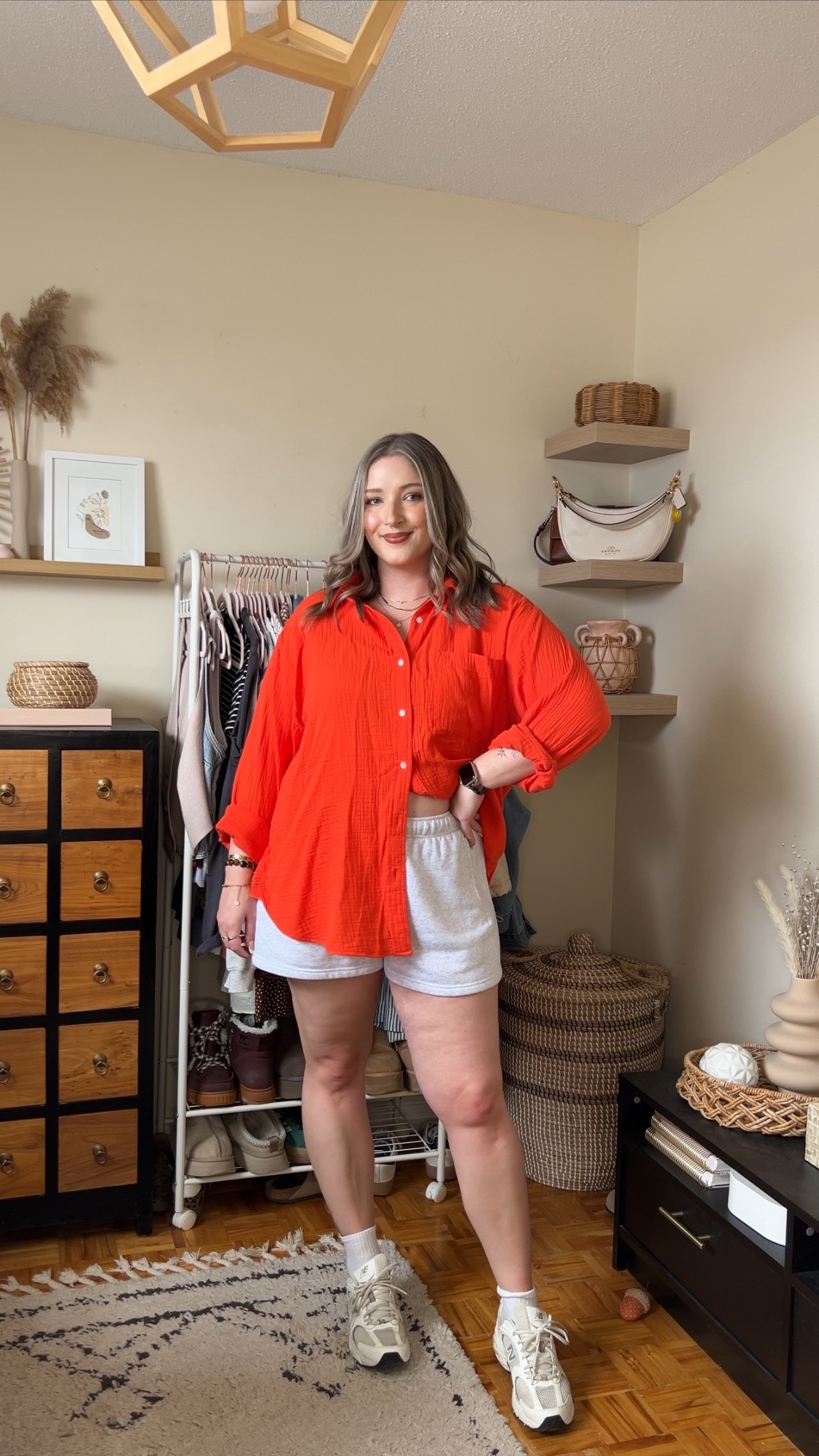 Casual spring to summer outfit on sale! Wearing my usual size L in the gauze coverup shirt (love this bright red orange, but it comes in a bunch of colorways), and my usual L in the sweat shorts. New Balance sneakers are super comfy but run big, I’m usually a 9.5-10 and wear a 9.

#LTKsummer #LTKmidsize #LTKsale