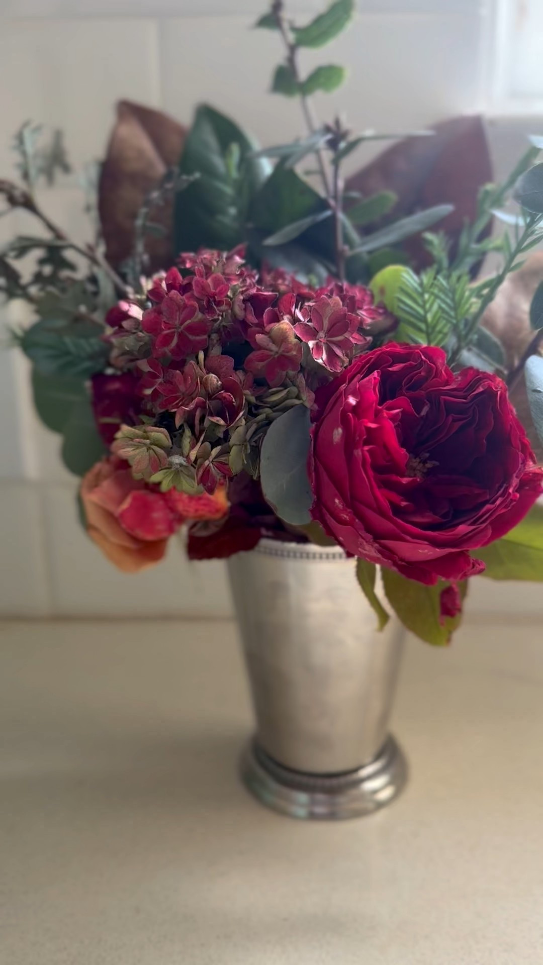 Ralph Lauren Thanksgiving floral arrangement in a mint julep cup! Koko Loko roses, red roses, an orange rose, hydrangeas, pine branches, Southern magnolia leaves, oak branches!! ❤️

#LTKHoliday #LTKSeasonal #LTKHome