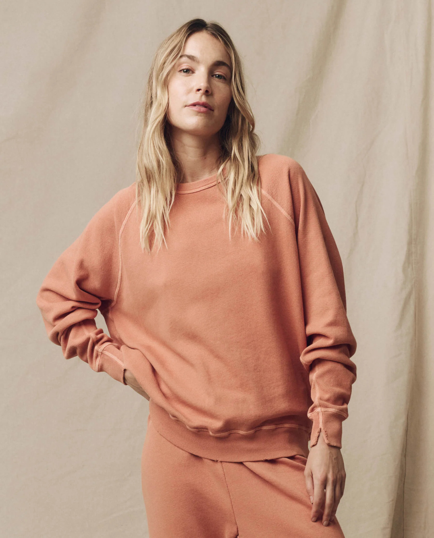 The College Sweatshirt. Solid -- Sun Dried Orange | THE GREAT.