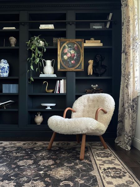 Shop my library room in our living room space and the decorative accents in our bookshelves!  #accentchair #library #homedecor #bookshelf #rugs #curtains #moody #modernvictorian

#LTKstyletip #LTKFind #LTKhome