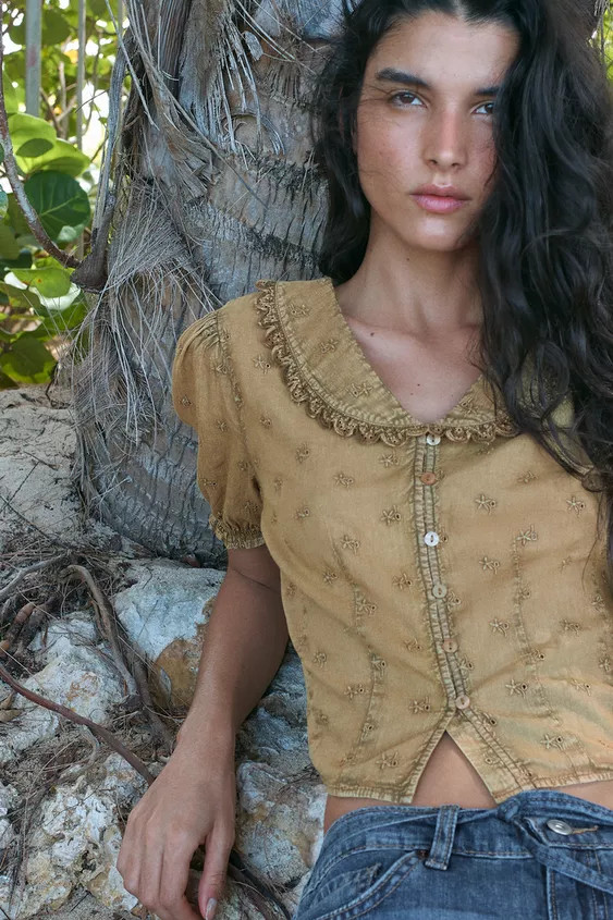 Peter Pan collar shirt with a V-neck. Features puffed short sleeves with elasticated cuffs. Adorn... | Zara UK