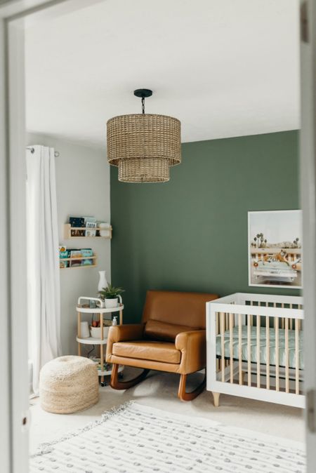 Green baby boy nursery with brown leather rocking chair and white crib. We love this accent wall color and the art we chose for the walls. Also, this rocker is seriously so comfortable and great for stains, as it’s so easy to clean. 

Full blog with room details and more photos: https://elizabethmccravy.com/nursery 

#LTKbaby #LTKkids #LTKbump