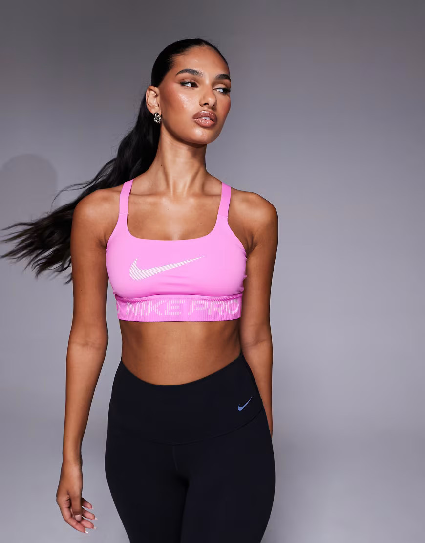 Nike Pro Training low support sports bra in pink | ASOS (Global)