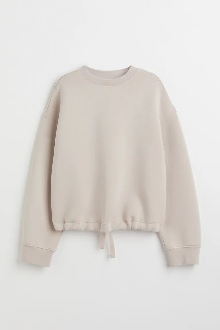 Crew-neck top in soft scuba fabric. Dropped shoulders, long sleeves, and ribbing at neckline and ... | H&M (US)