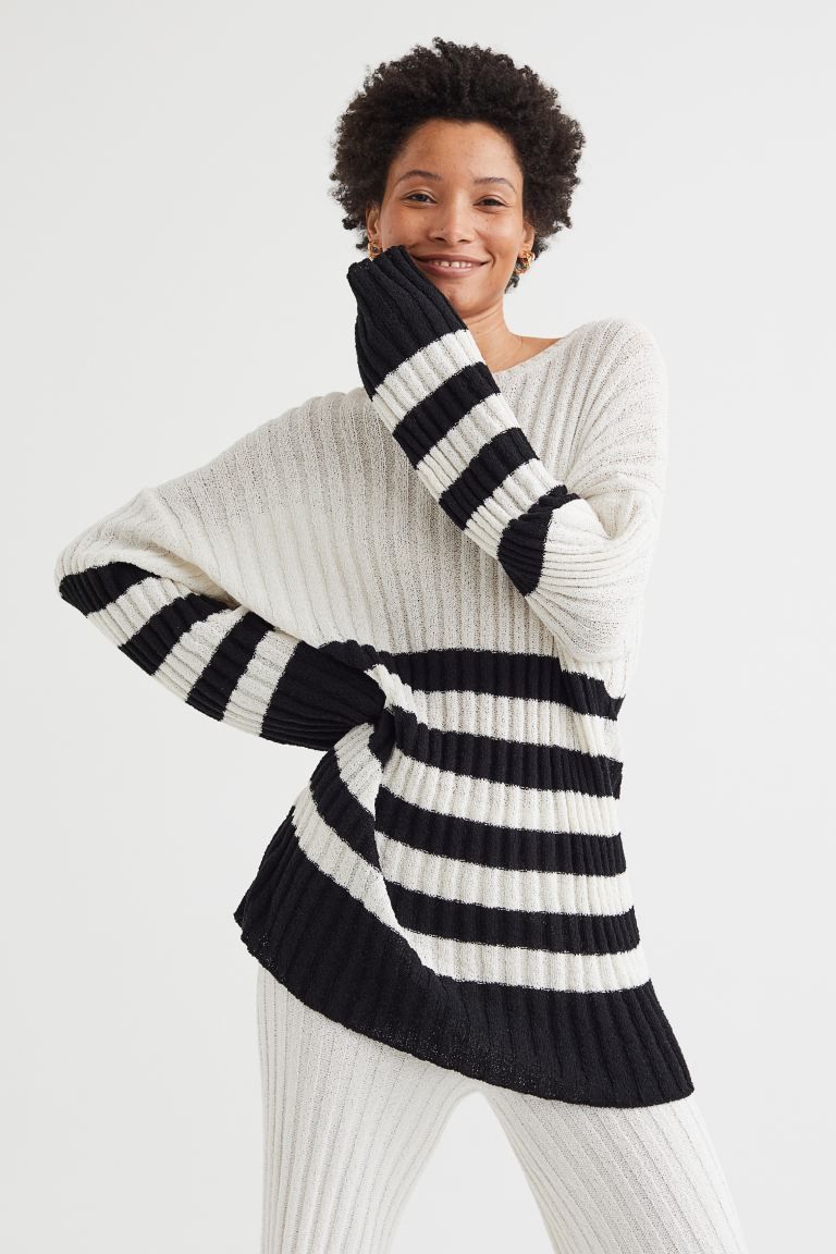 Oversized jumper in a soft rib knit with a boat neck, low dropped shoulders and long, wide sleeve... | H&M (UK, MY, IN, SG, PH, TW, HK)