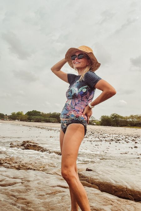 Johnny Was short sleeve rash guard and matching bikini. Size down in the top and bikini bottoms. 

#LTKswim #LTKtravel #LTKSeasonal