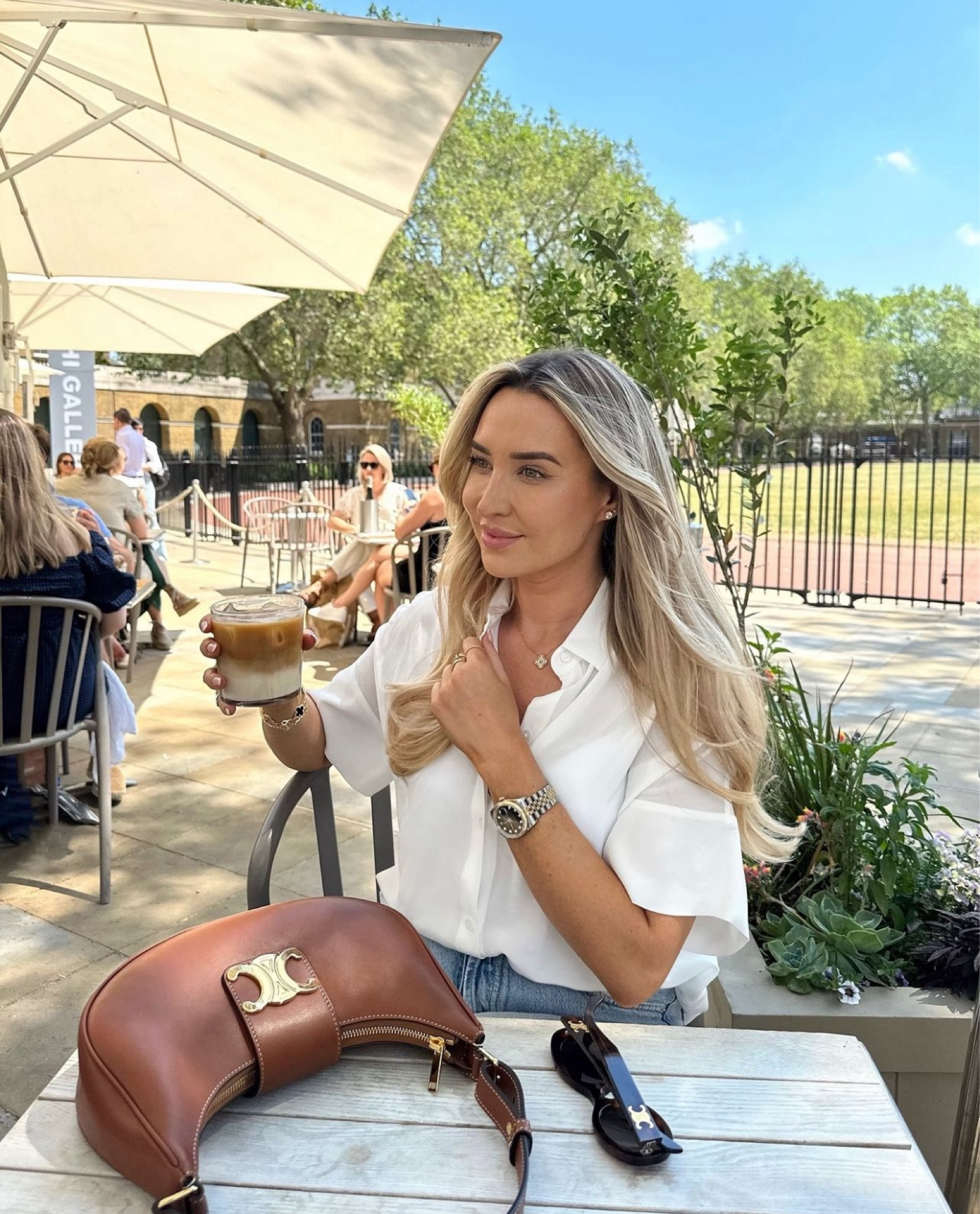 City Look 3 - Cropped silk white shirt and baggy blue jeans, styled with tan Celine and Hermes accessories, perfect for smart casual workwear

#LTKuk #LTKautumn #LTKsummer