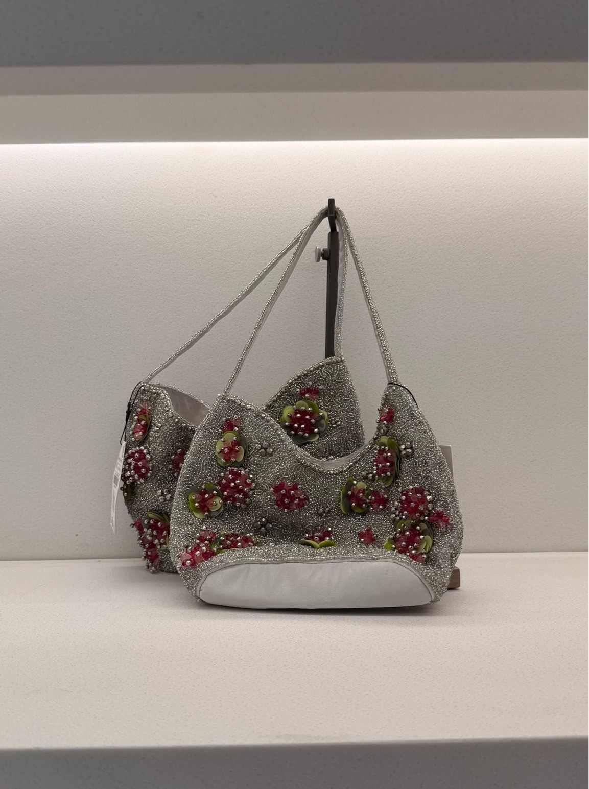 Grey shoulder bag with red beaded embellishments! Statement bag find!

#LTKootd
