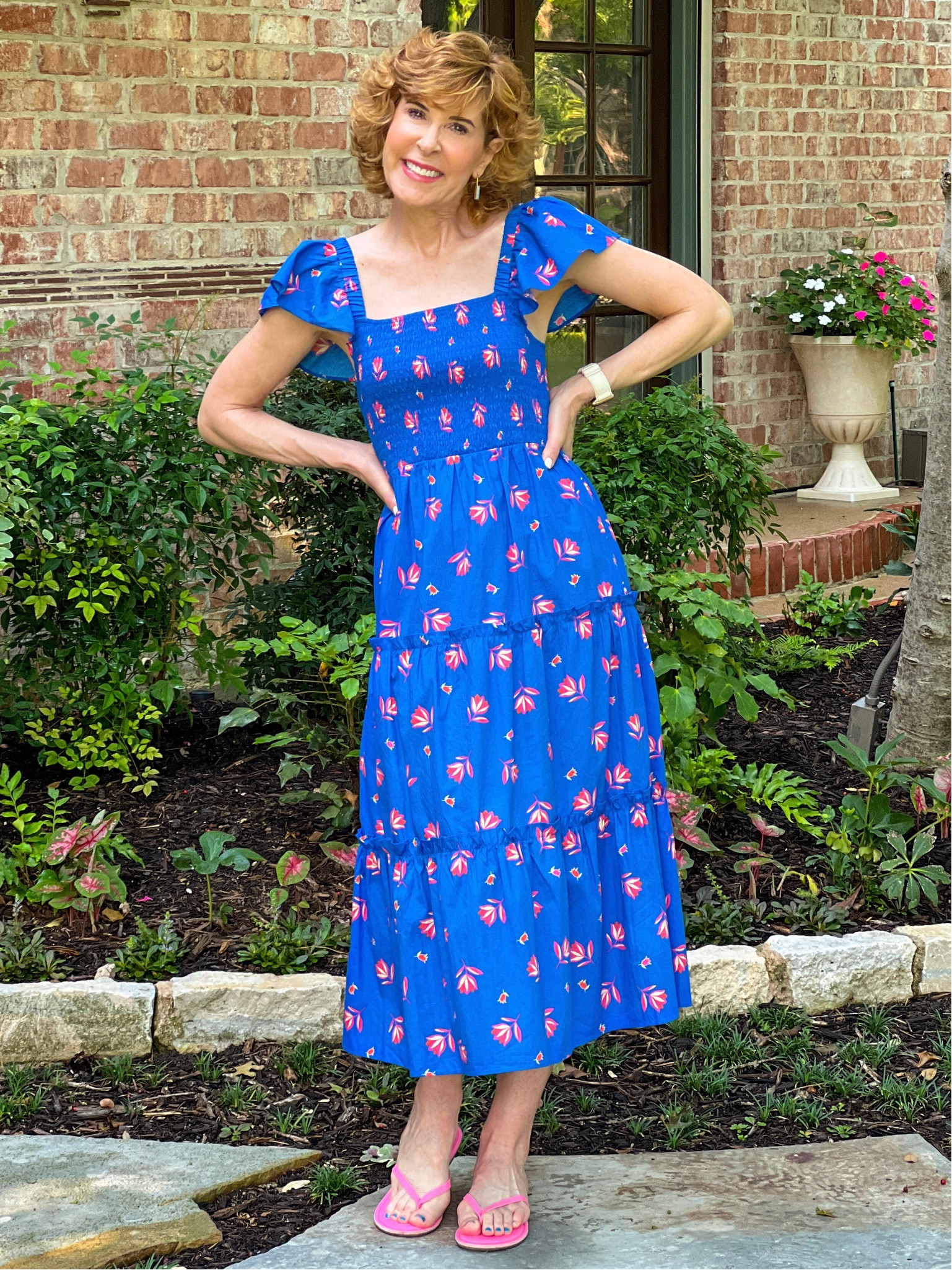 This tiered ruffle sleeve dress has a smocked top for a flattering fit! I love the cobalt blue color, with sweet touches of pink! 

I paired it with simple hot pink flip flops for a fun summery look that’s all about femininity.

#LTKunder100 #LTKstyletip #LTKSeasonal