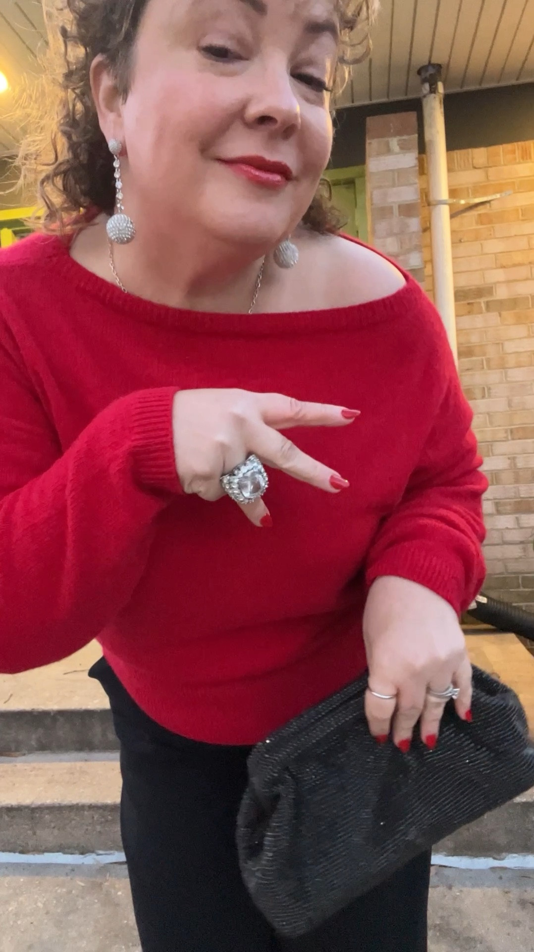 Oh the power of accessories and a statement lip! 💄 

I see so many holiday looks that are just too fancy and complicated for real-life. My go-to is a sweater in a festive color, drapey black trousers, polished black booties, and being a quick change artist with jewelry, bag, and makeup. This sweater is perfect as it goes from bateau to off the shoulder for extra drama.

Sweater: @anntaylor (L)
Pants: @mmlafleur (14)
Booties: @francosarto 
Bag: @loft (old; linked to similar)
Earrings and ring: both @anntaylor and old but linked to similar
Face color and brush: @merit 
Lipstick: @lorealparis Matte-Traction Red
Lip gloss: @sephora 
Stainless ball chain necklace and dome ring: @amazon 
Coat: @loft (XLP) 

#LTKMidsize #LTKHoliday #LTKOver40