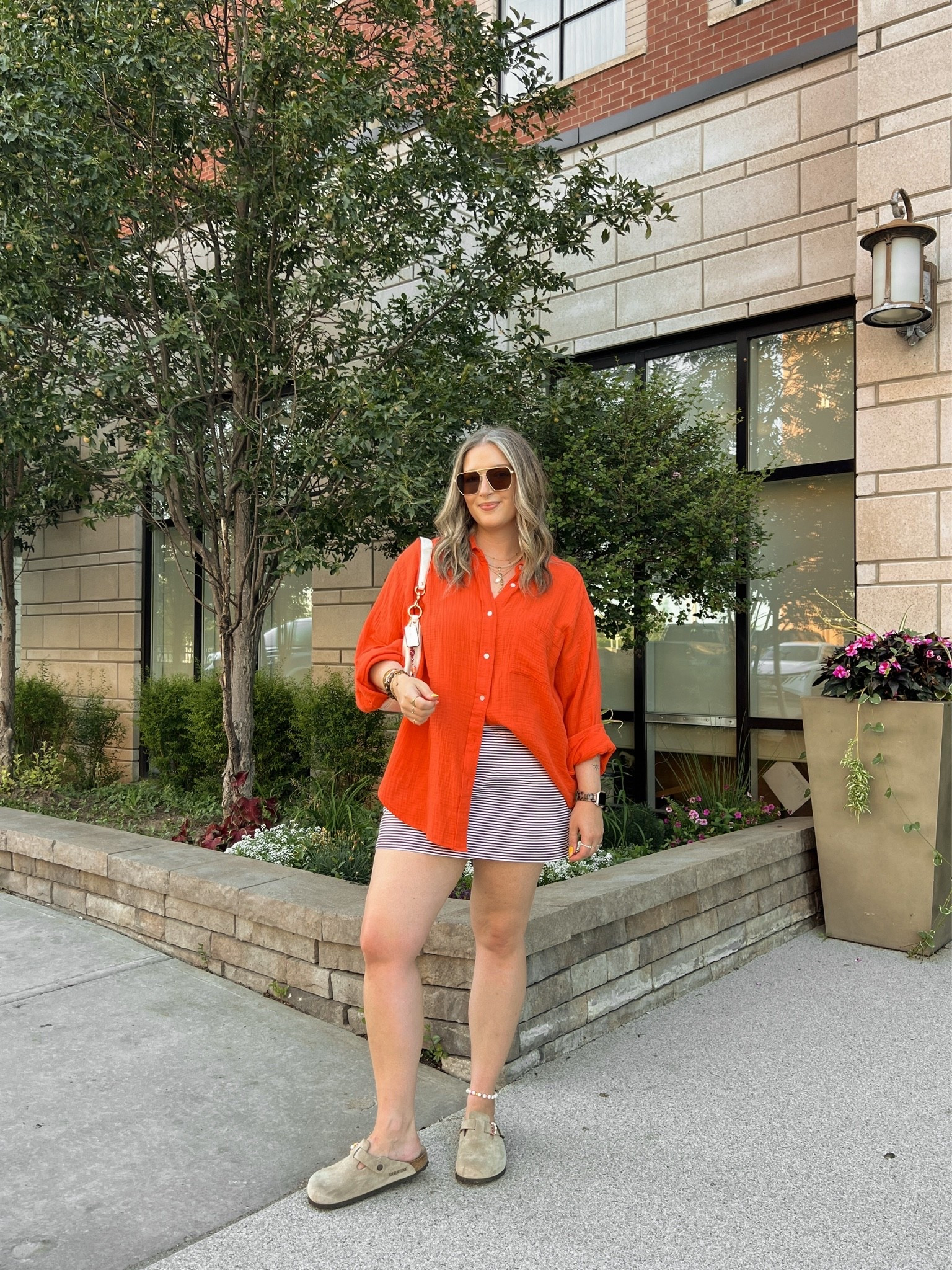 Easy summer outfit! Wearing my usual size L in both the red orange shirt and striped mini skirt (has built in shorts!). Birkenstock Bostons are super comfy, I’m a 9.5-10 shoe and wear size 40

#LTKsummer #LTKsale #LTKmidsize