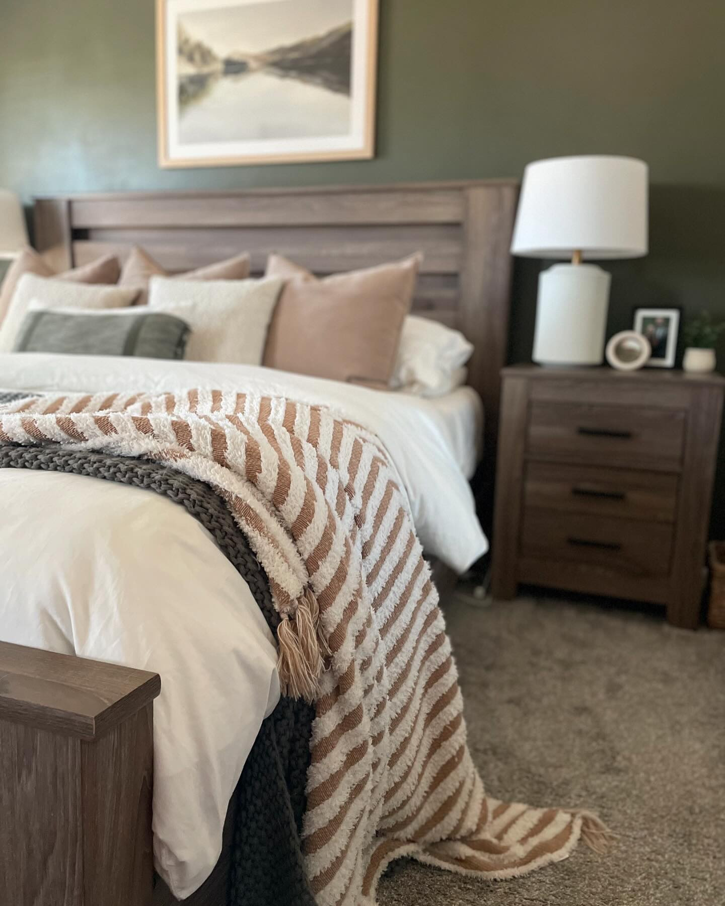 ✨PRIMARY BEDROOM VIEWS✨

Haven’t shared any stills on my bedroom in a long time, and it’s still one of my most asked about spaces across platforms. I still love this space and the colors so much. The print above our bed is what inspired it all. The space feels so cozy and calming! 

There’s still several things to do in here. I’ve wanted to add frame moulding on the accent wall since I painted it 2.5 years ago 🙃, I want to switch out the fan, and add some curtains for extra coziness. I also have an “office” in here that I would like to add a gallery wall above. Eventually I would like to replace all the furniture in here 😬 but for now I’m enjoying it in the present. Home takes time friends. Just your Tuesday reminder!🫶🏻
.
.
.
.
.
.
#primarybedroom #greenpaint #earthytones #earthyneutrals #cozyhome #layeredlook #homestylinginspo #transitionalhome #transitionalstyle #modernorganic