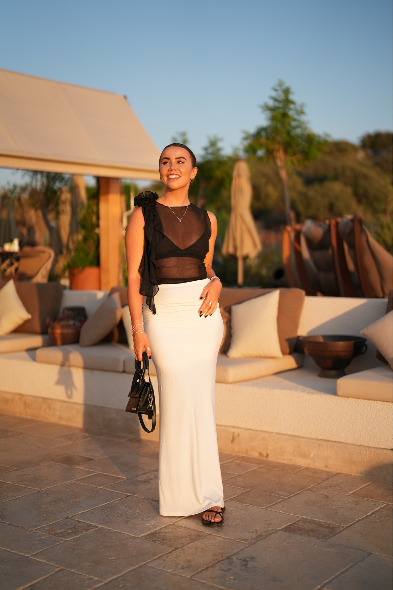 Sunset dinner inspiration in Türkiye 🇹🇷 🤍 wearing mesh flower corsage detail top with tala seamless maxi skirt and simple minimal sandals. The perfect chic dressed up dinner look. 

#LTKSeasonal #LTKunder50 #LTKstyletip