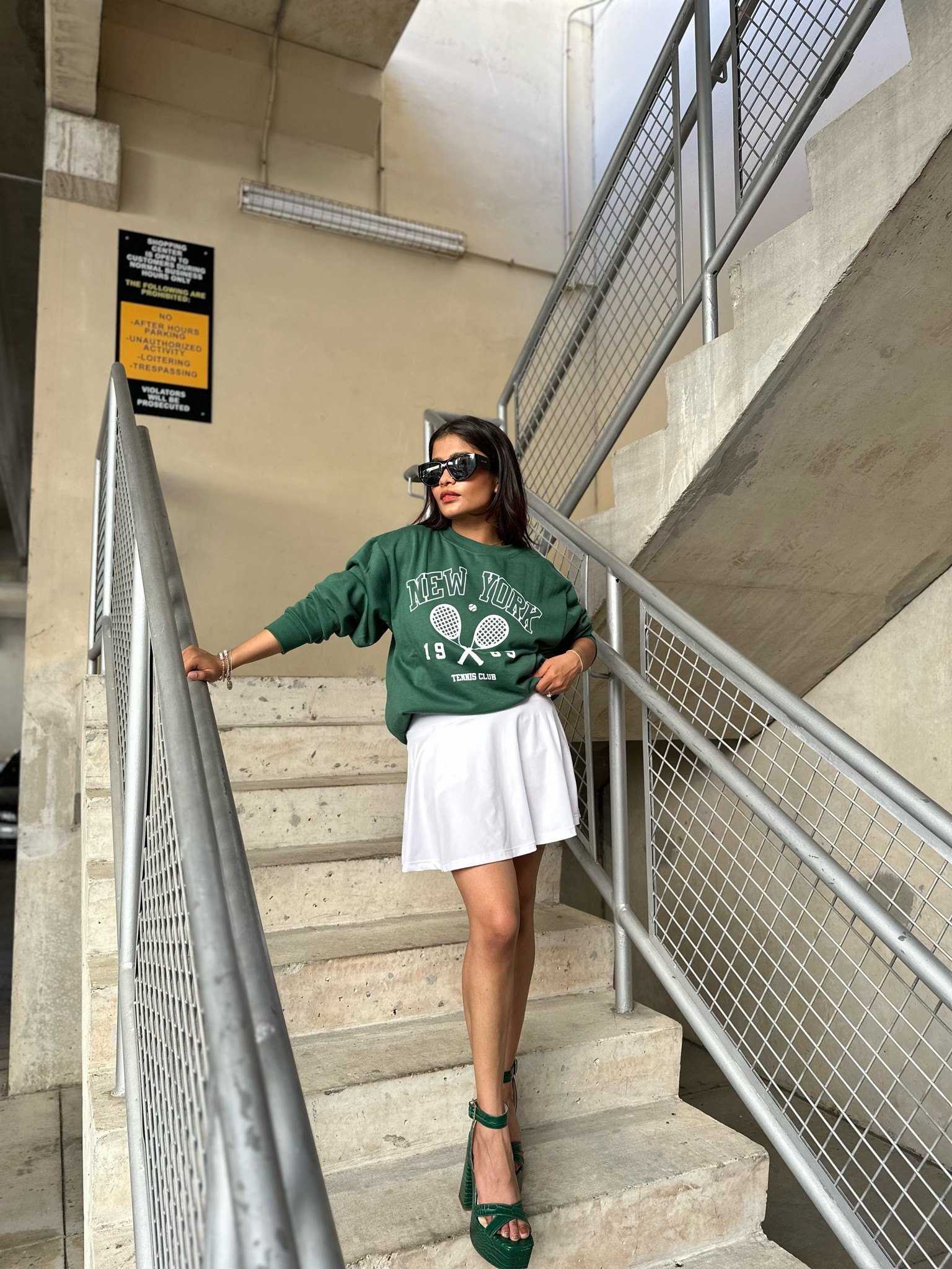 Dark green, New York, tennis sweatshirt that is five dollars. Wearing medium. Paired with white tennis skirt and dark green platform sandals/heels (~4.75” with 2” platform)—true to size and comfortable. 

#LTKshoecrush #LTKtravel #LTKunder100