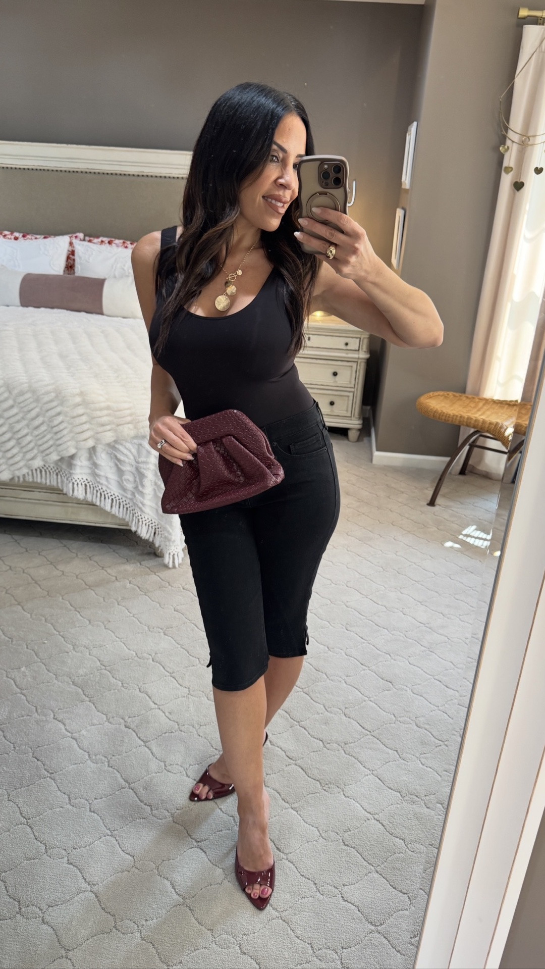 Who else is thinking about their transitional wardrobe? I&rsquo;m starting with this all-black foundation, a black tank bodysuit, fitted denim capris (that are on clearance!), and a stunning pair of burgundy sandals with a matching clutch. My absolute favorite trick for taking these summer looks right into fall is to layer on a denim bomber jacket! It's the perfect easy-to-pop-over piece for any outfit. Trust me, it's a game-changer for a smooth season change. 🖤✨ #fallfashion #walmartstyle #styletip #dreampairs