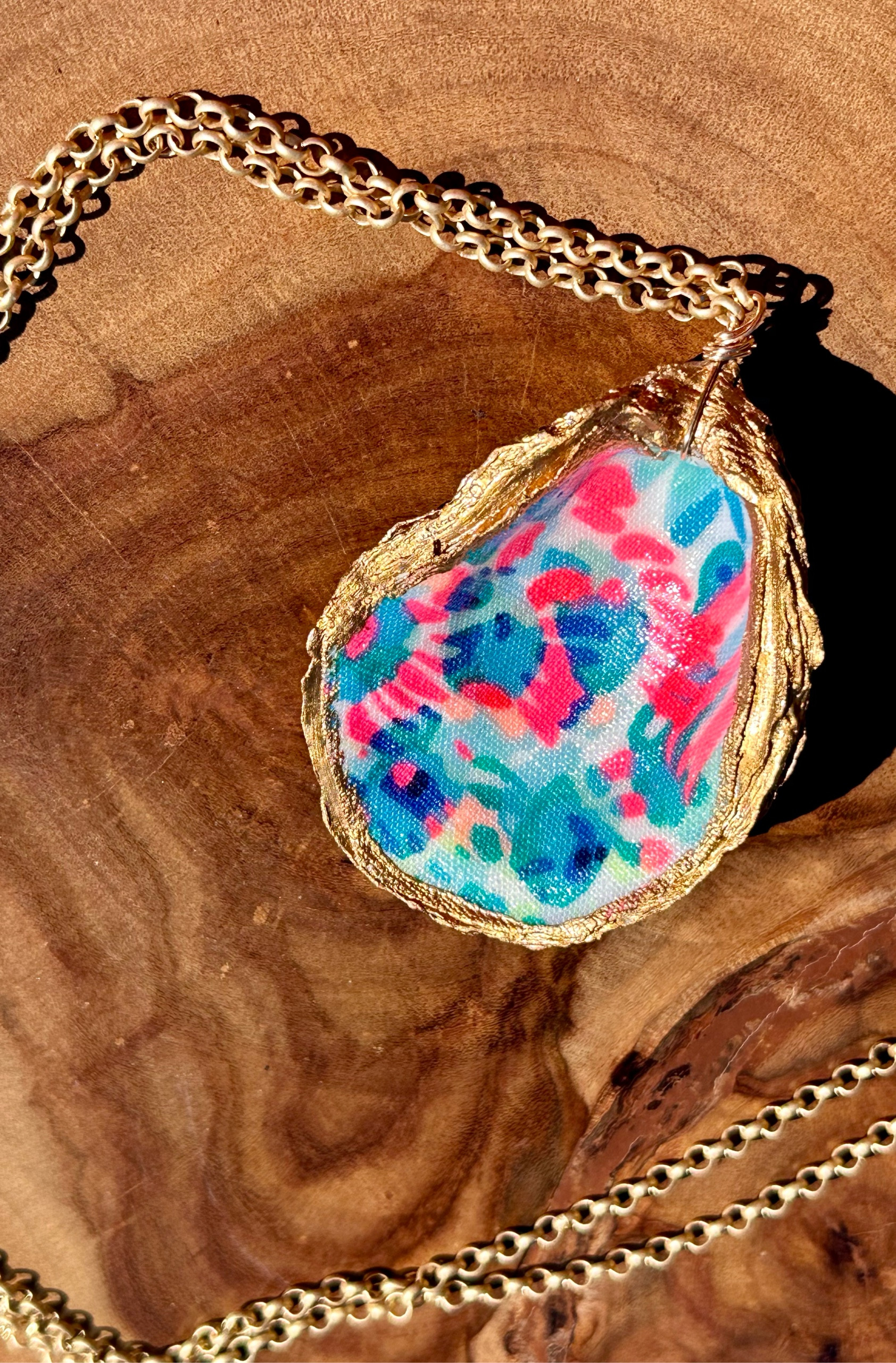 Spring is here! These custom made Lilly Inspired Oyster fabric necklaces are perfect to go with all of your favorite spring and summer Lilly! Perfect for Easter baskets and dresses too! You can pick silver or gold chain (average length 38 inches) and your favorite Lilly fabric! The oyster shells average 3 inches! Made in South Carolina! I love these💗💚 #lilly #etsy #oystershells

#LTKSeasonal #LTKstyletip #LTKfindsunder50