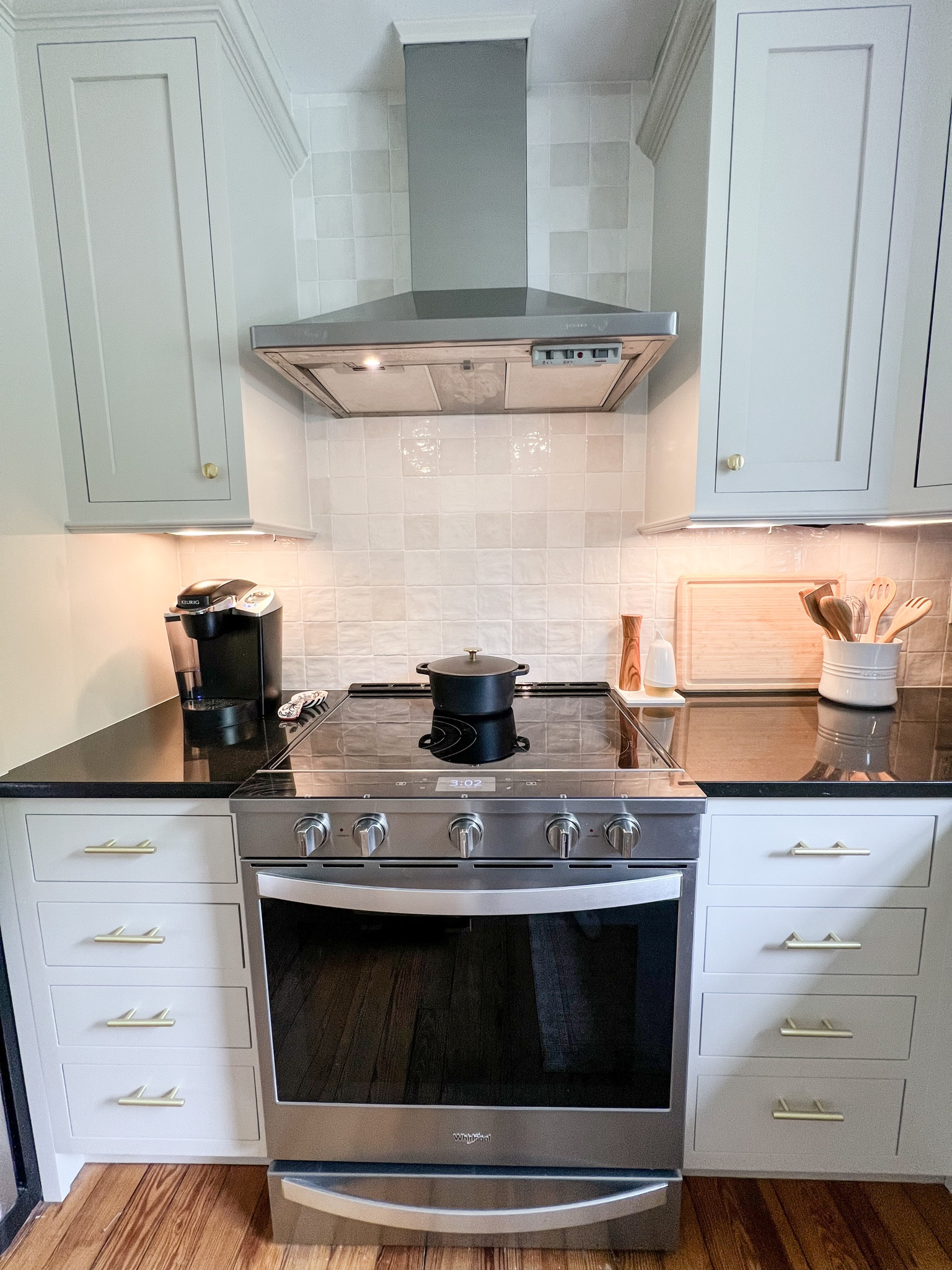 Kitchen view featuring creamy, square tile backsplash, Le Creuset Dutch oven and utensil holder, and bamboo wood accents. 

The tile is from TileBar but I’ve linked similar. If you’re doing this as a DIY, highly recommend you take the tile out of the boxes once received and move it all around to different piles to get the ‘random’ look. 

Cabinet paint color is Edgecomb Gray by Benjamin Moore.

#LTKhome #LTKfamily #LTKstyletip