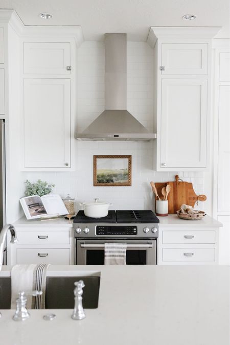 In our all-white kitchen I love to use wood and brass accent pieces to warm it up- things like wood cutting boards, wood risers and brass artwork frames. 

#LTKFind #LTKstyletip #LTKhome