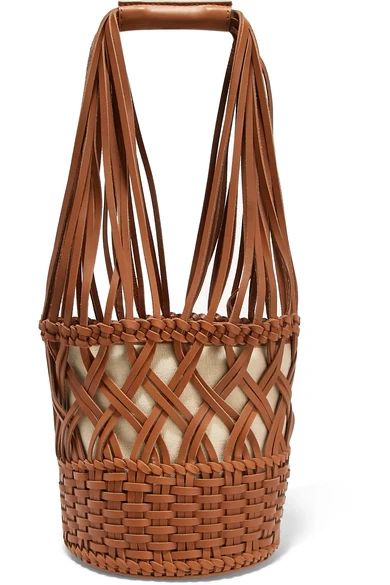 HEREU
				
			
			
			
			
			
				Anna woven leather bucket bag
				$500 | NET-A-PORTER (US)