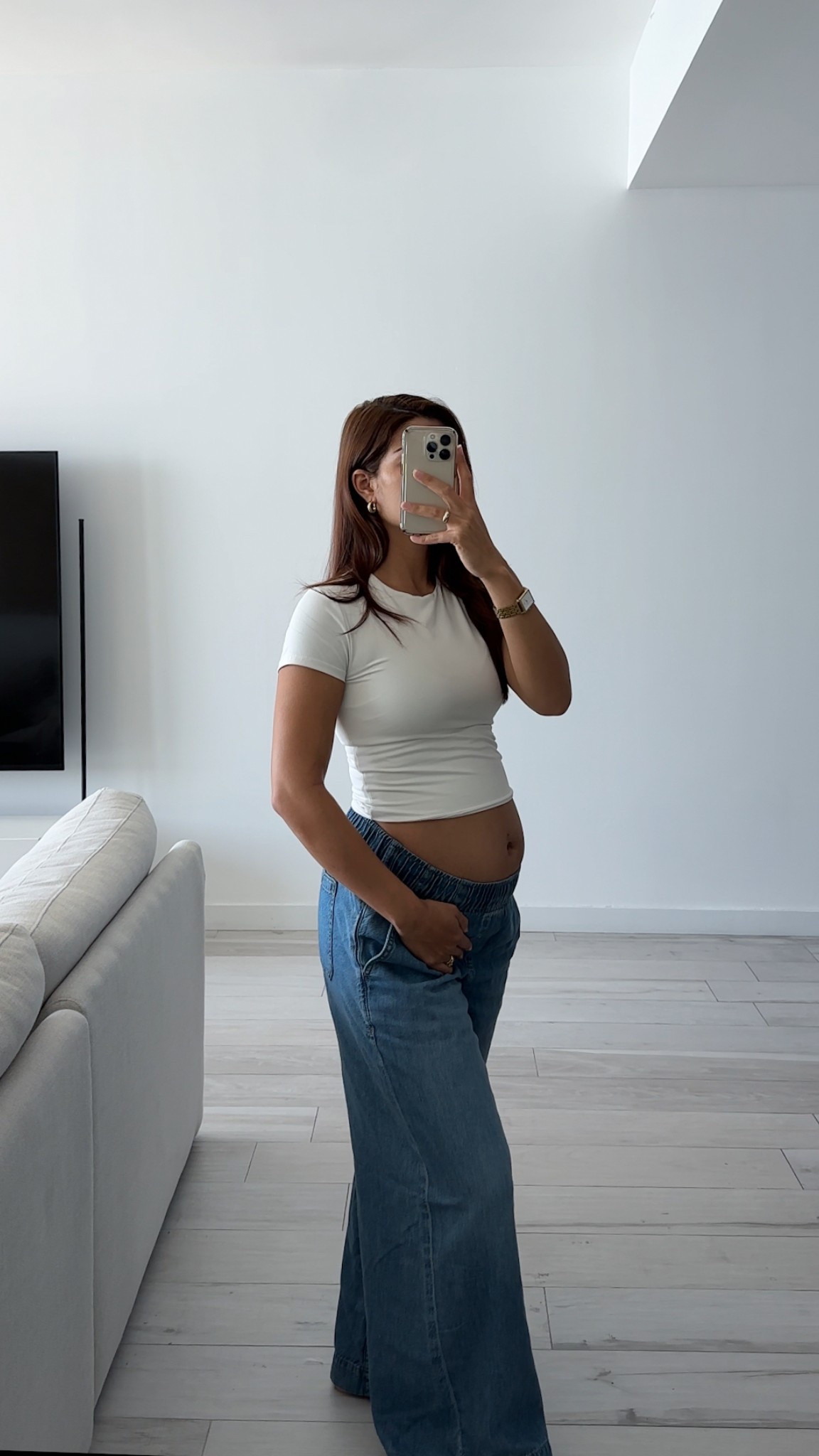 non-maternity bump friendly jeans! wearing a size medium, I would size up from your normal size to account for the bump