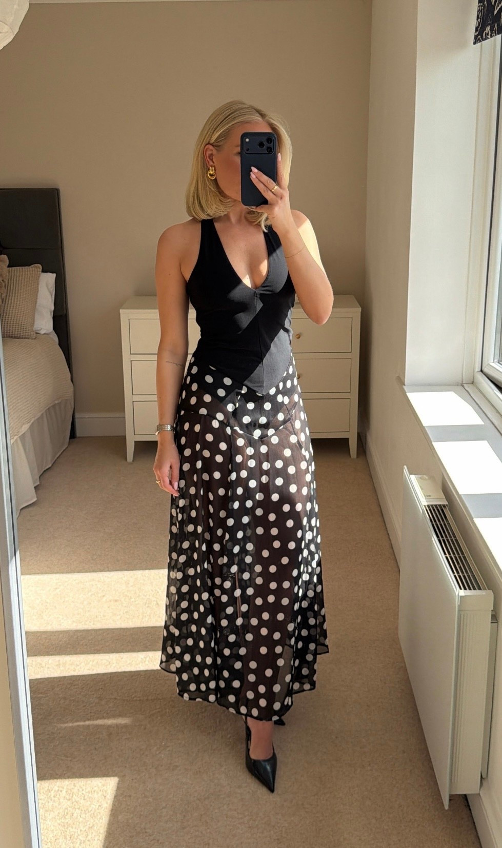 Holiday dress 
Polka dots 
Black and white 

#LTKstyletip #LTKspring #LTKpartywear