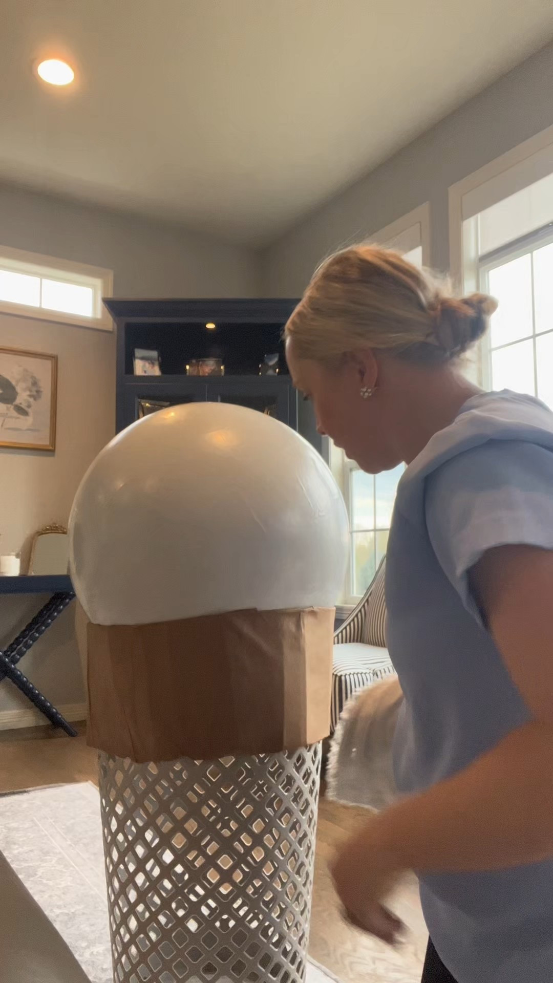 Supply list - 
2 cone shaped tall laundry baskets. I found these at Target for $7 a piece.
2 medium sized exercise balls (21-25 inch fits well in these baskets). These were $5 a piece balls from Five Below. 
Cardboard cut into strips (I disassembled a medium sized Amazon box and used almost the entire box) I cut along the seams and used the flaps for the rims. 
Hot glue sticks and glue gun
A box cutter or exacto knife
Painters tape
Scissors
Brown butcher block paper 
Elmer’s glue (I bought a large size jug) and am using a 2 parts glue to one part water ratio to create a paste.
Medium and large paint brushes (found for
$2 at 5 below) 
Acrylic paint for both the cone and whatever colors you choose for the icecream (found a full paint set at 5 Below) 
Gaps and Cracks foam spray (bought two cans for around $6 a piece) you can purchase at Lowe’s, Home Depot, or home improvement store.
2 small plastic red balls for a cherry on top of the cone (I’m stealing two from Isaac’s ball pit!) 
A container of Crayola quick dry clay for the sprinkles (found at 5 Below for $5, but Target also carries it).

I use a 2 to 1 Elmer’s glue to water ratio and cut out brown butcher block paper (or craft paper) to  paper-mache the paper onto both the laundry basket, cardboard, and exercise ball. I used a medium sized paint brush. 

#LTKKids #LTKParties