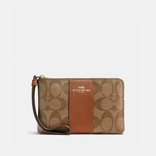 Corner Zip Wristlet In Signature Canvas | Coach Outlet CA