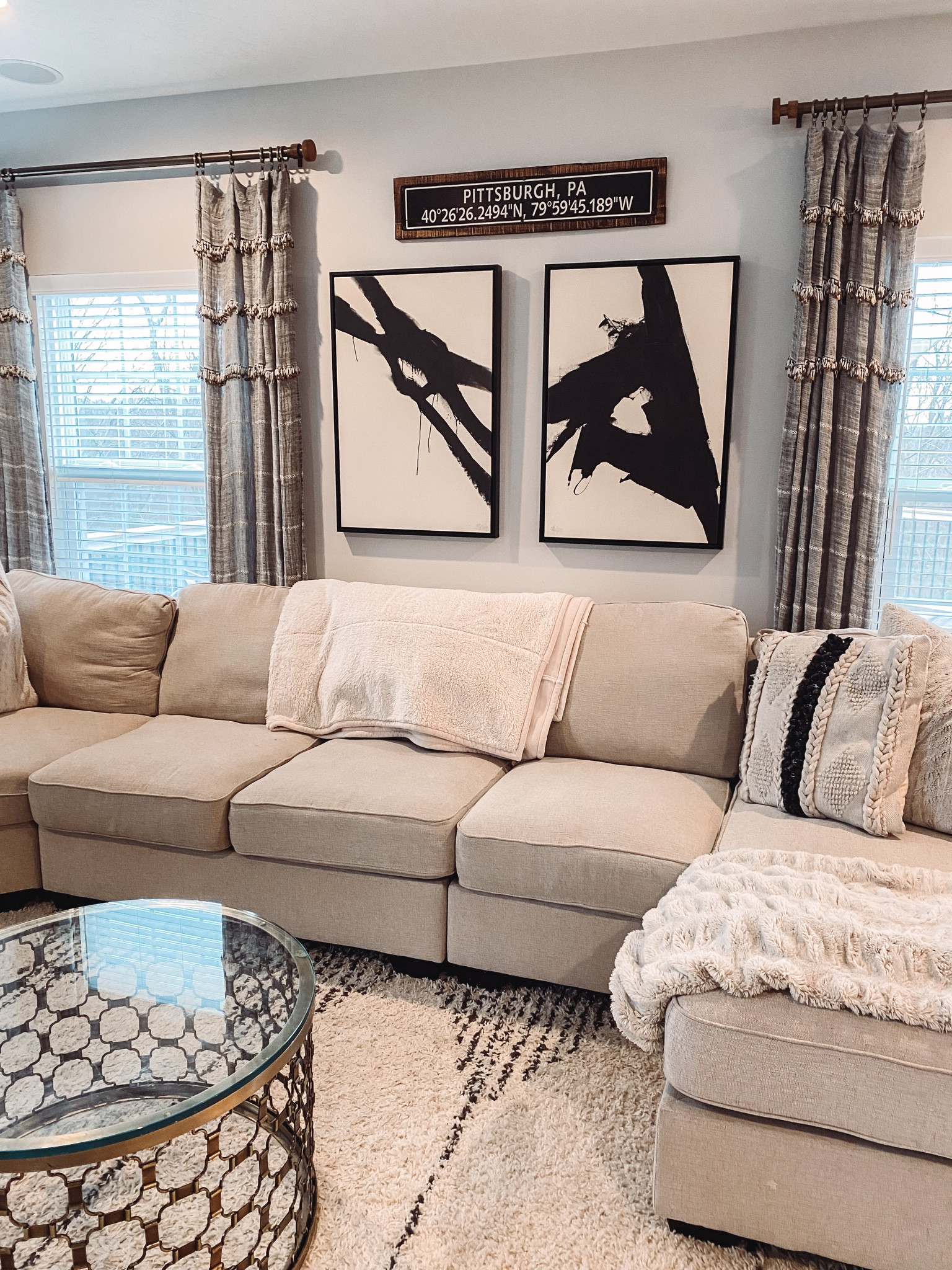 Black and off white living room home decor- with accents of brass and wood tones 

#LTKFind #LTKunder100 #LTKhome