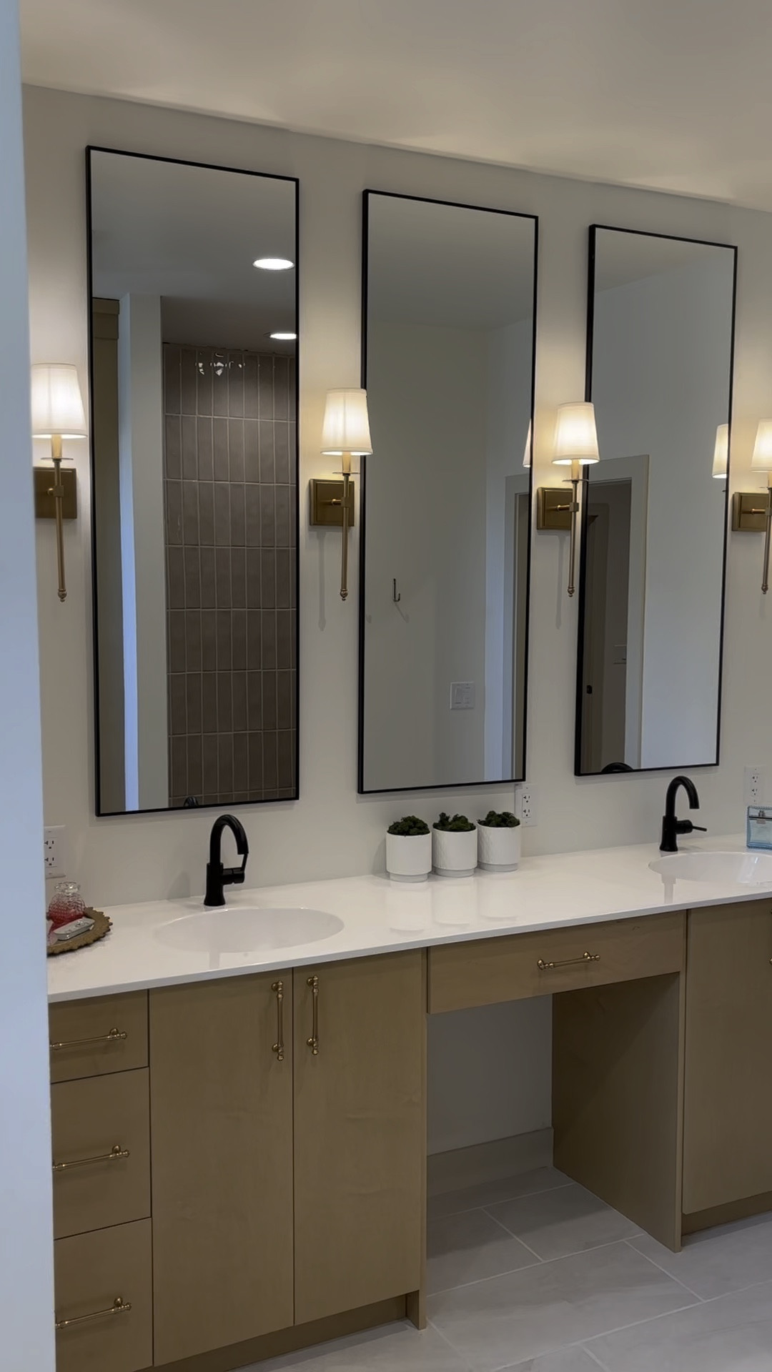 sharing our master bathroom details! ⚡️

I added oversized mirrors to every bathroom in our new build per our designers recommendation, & it was the best decision!! makes the room feel & look HUGE. 

these gold light fixtures are such a great price & could be used for multiple rooms throughout the house!

the hardware is the perfect combo to bring out the modern cottage look for our house. they look like jewelry on our cabinetry. 🤩

#LTKstyletip #LTKVideo #LTKhome