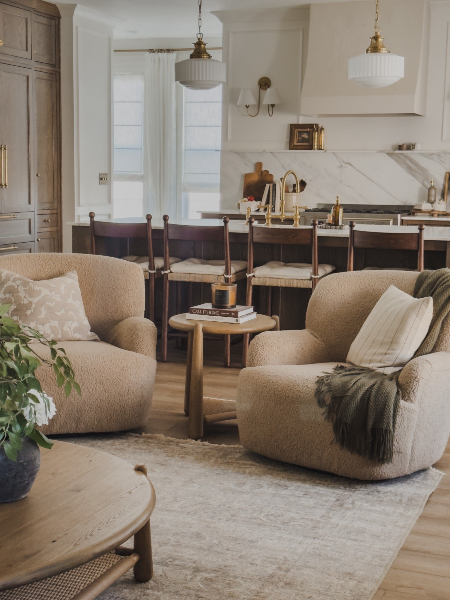 A closer view of my cozy, oversized swivel chairs! When choosing quality over quantity finds - these chairs are no exception. The plush but durable seating provides all the comfort without sacrificing any aesthetic!

Home finds, neutral home inspo, neutral wood tones, furniture favorites, collected style, cozy throw pillow, barstool details, round oversized coffee table, faux florals, neutral area rug, Four Hands, Loloi, Amber Lewis, Pottery Barn style, shop the look!

#LTKSeasonal #LTKHome