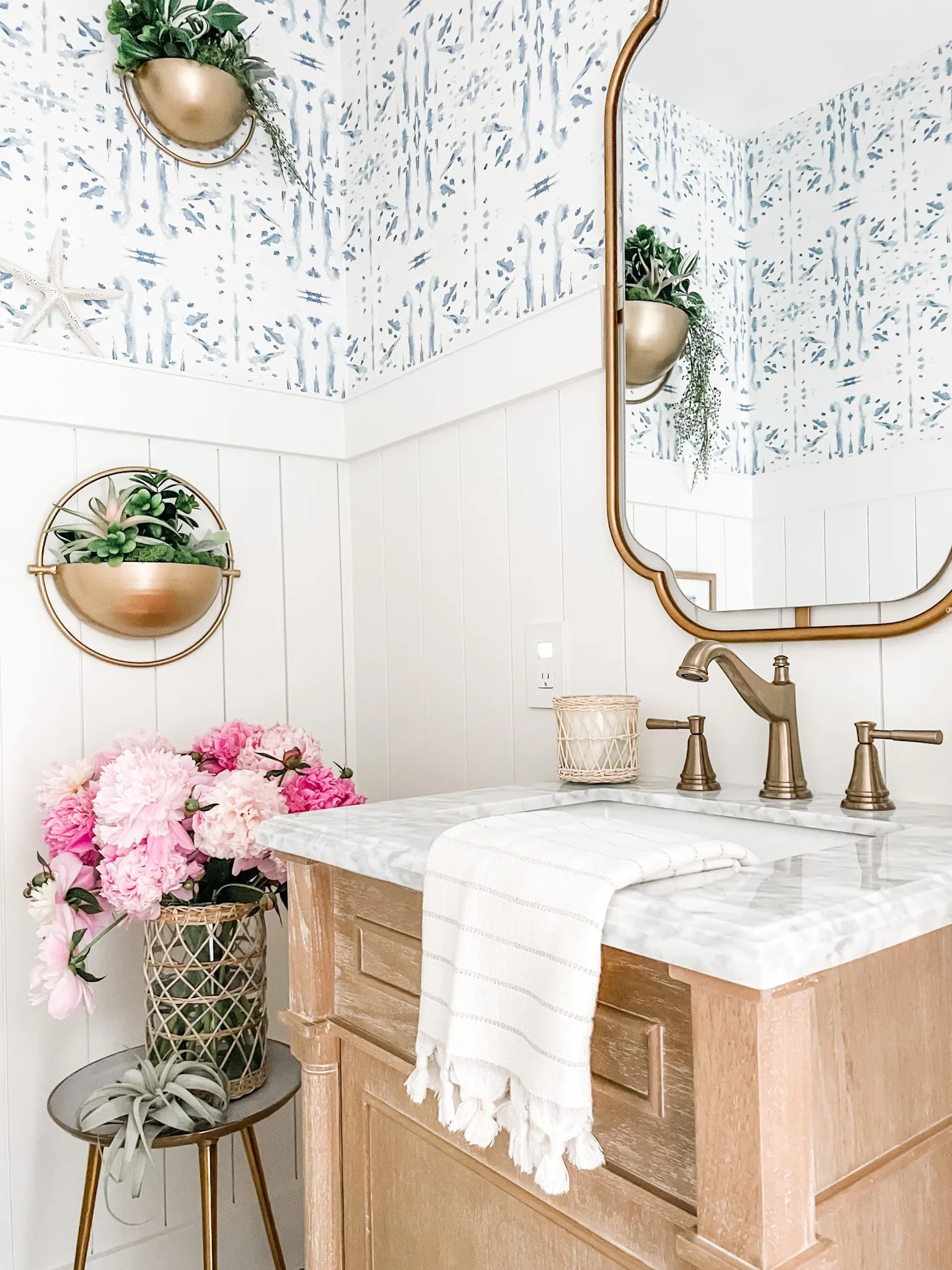 We remodeled this powder room last year with a coastal vibe and love this antique oak bathroom vanity with white Carrara marble top!

Powder room decor, bathroom vanity, 24” vanity, champagne bronze faucet, bathroom sink faucet, herringbone tile, wall mirror, bathroom mirror, Kolher toilet, wall art, hanging wall planter, half bathroom, Turkish hand towel, woven rattan vase, three legged table, white bath rug, woven trash can, waste basket, white ceramic soap dispenser, toilet paper holder. 

#powderroom #bathroom #vanity

#LTKFind #LTKhome #LTKstyletip