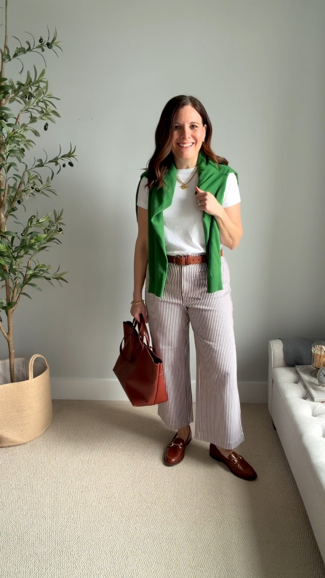 These LOFT brown striped pants are
stretchy, comfortable, and so cute, and they would be great for everything from work to a night out.
I tried my true size and a size down and decided to keep my true size.
The rise is 11 ⅜ inches, and the inseam is 26 inches.
Note that the website image shows white buttons on the patch pockets, but they actually arrive with brown buttons.
Wear these pants with everything from a pullover sweater to a white tee with a cardigan or denim jacket, or even a chambray shirt. #work


#LTKSaleAlert #LTKOver40 #LTKMidsize